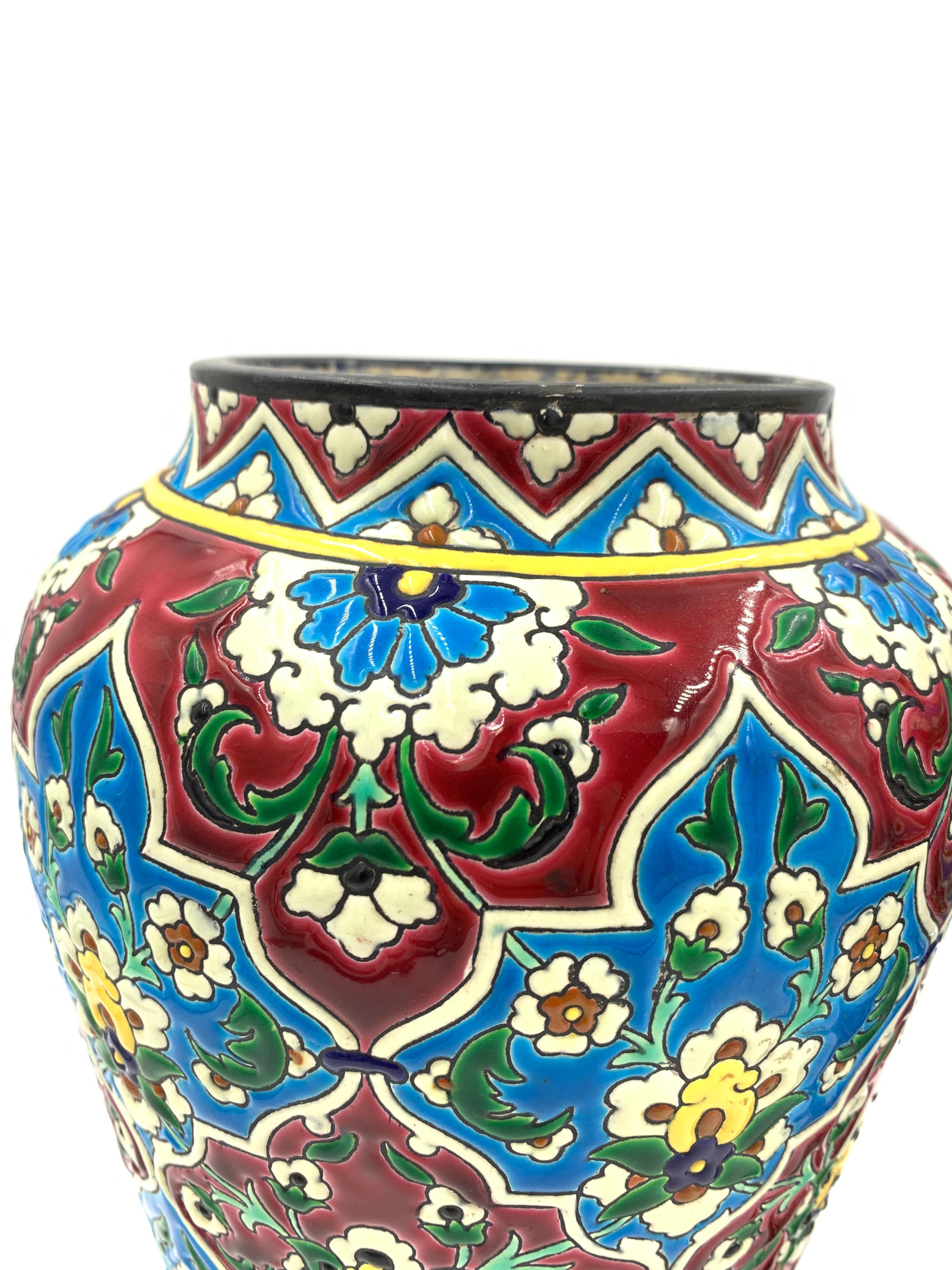 A mesmerising colouring and design further draw our attention to the French enamelled faience pair of vases by Jules Vieillard! The Bordeaux made pair date between 1845-95.