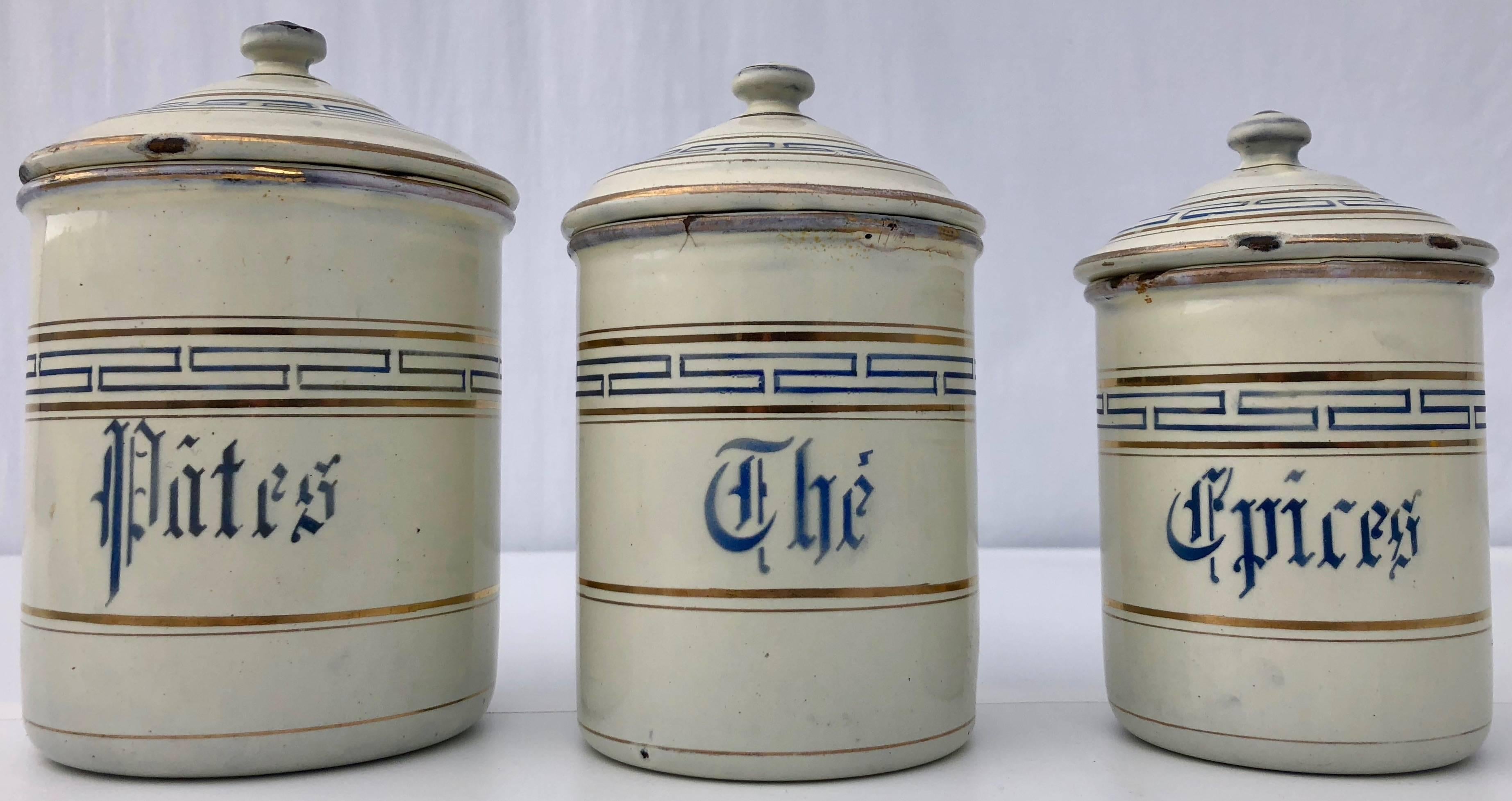 white and gold canisters