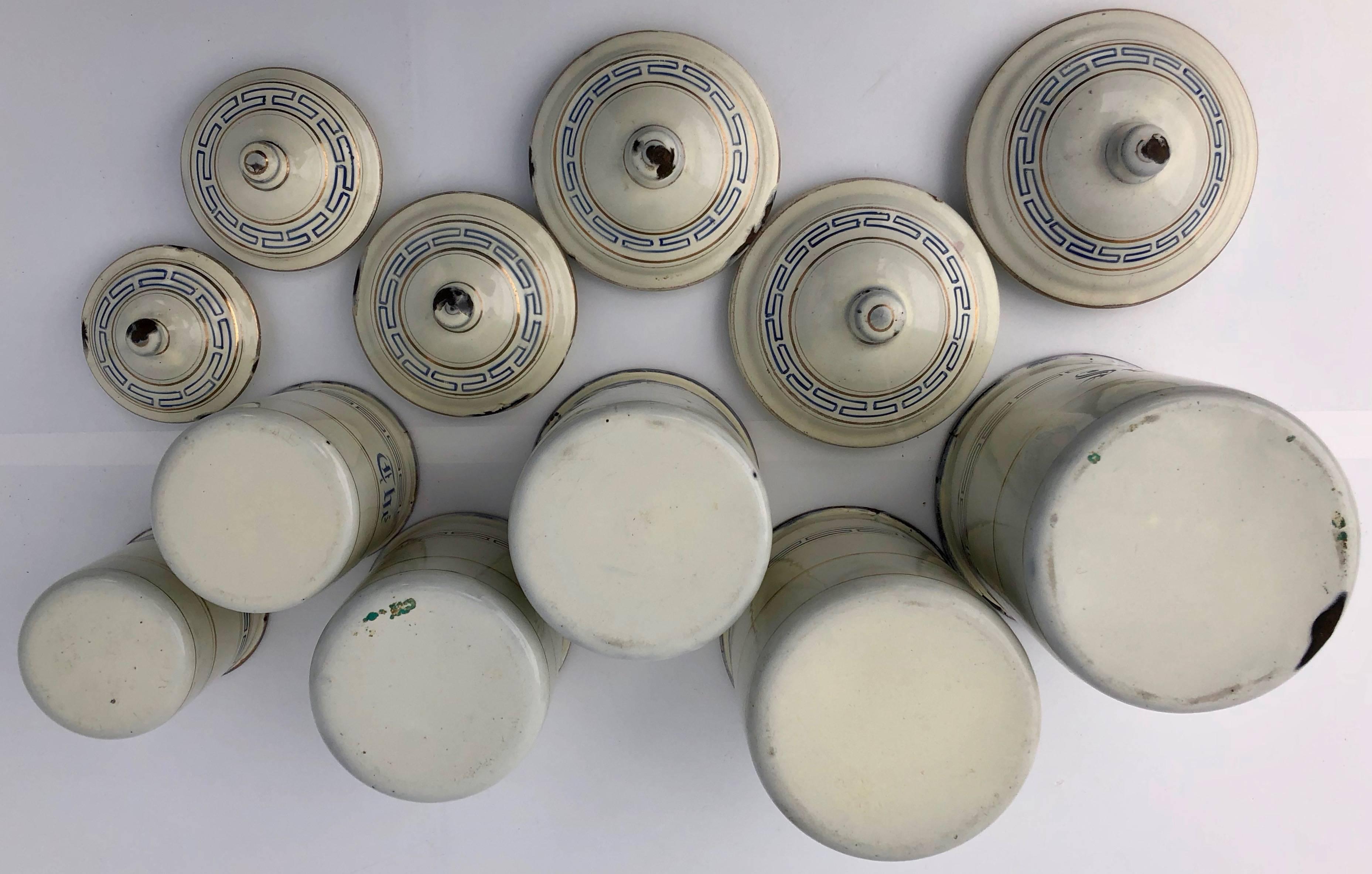 French Enamelware Antique Canister Off-White with Blue and Gold Trim, 12 Pieces In Good Condition For Sale In Petaluma, CA