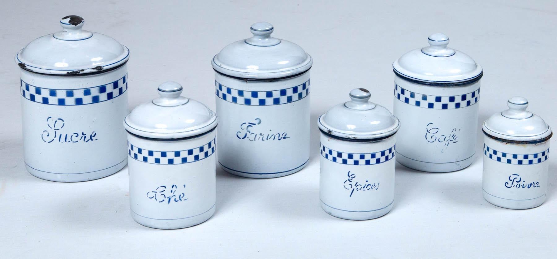 French enamelware cannister set, circa 1920. Set of six, with graphic blue and white checkerboard design on white ground.