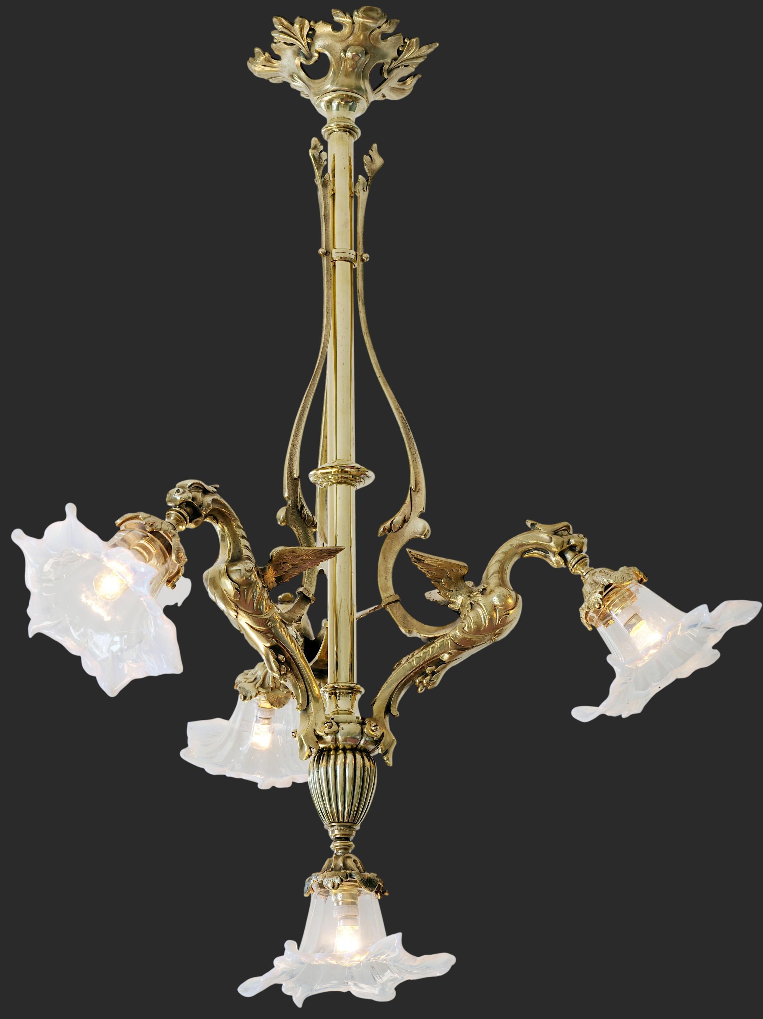 French end 19th century bronze chandelier, France, 1880-1890. Dragons. Solid bronze fixture showing 3 dragons. 3 Very precious lampshades in blown-moulded thin semi-crystal stretched with a clamp. The corolla of the flowers ends in an opalescent