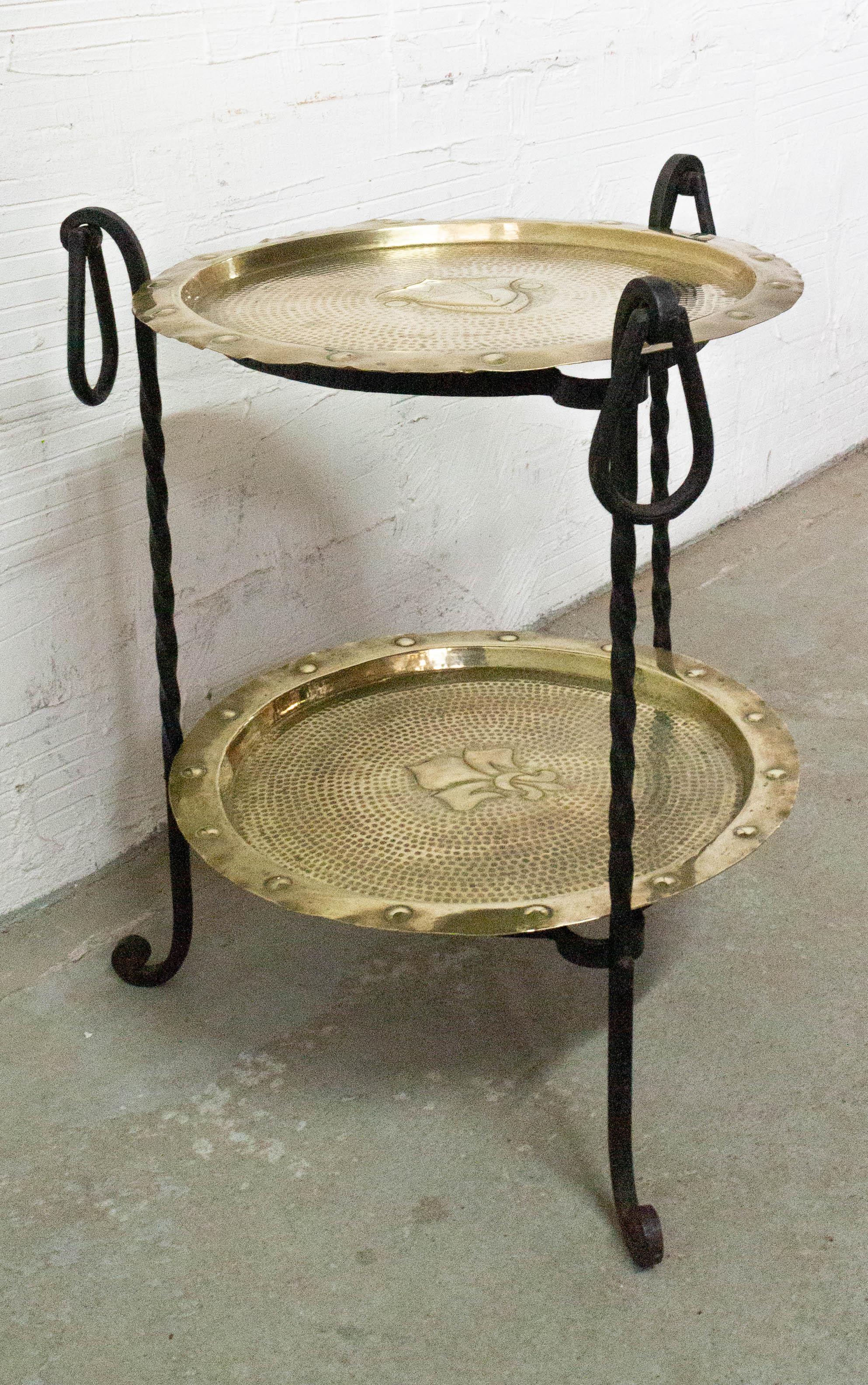 Midcentury side or end table, France
Can also be used as coffee table or plant holder
Copper and wrought iron
The patterns in the middle of the trays are a fleur-de-lis and a tower in the middle of a landscape
Measures: Diameter of the trays