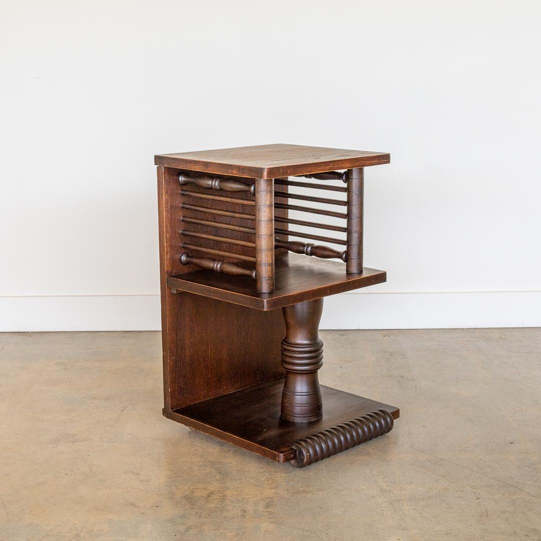Beautiful carved wood end table by Charles Dudouyt from France, 1940's. Ornately carved slat and column detail with one shelf. Original finish shows great age and patina. Bold and functional piece. Perfect as a bedside or end table. Multiple