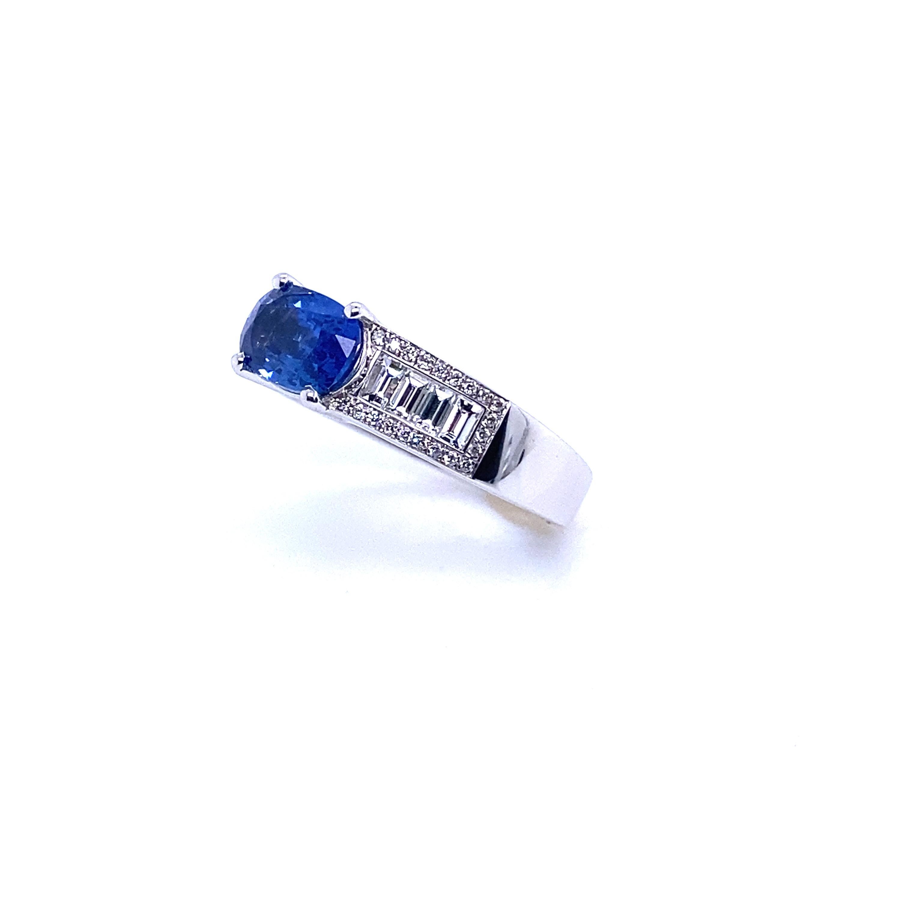 French Engagement Ring White Gold with a Blue Sapphire and Diamonds
French Collection by Mesure et Art du Temps.

This ring is surmounted by a cushion-cut blue sapphire of 1.74 carats. 
It is accompanied by 8 baguette-cut diamonds of 0.36 carats and