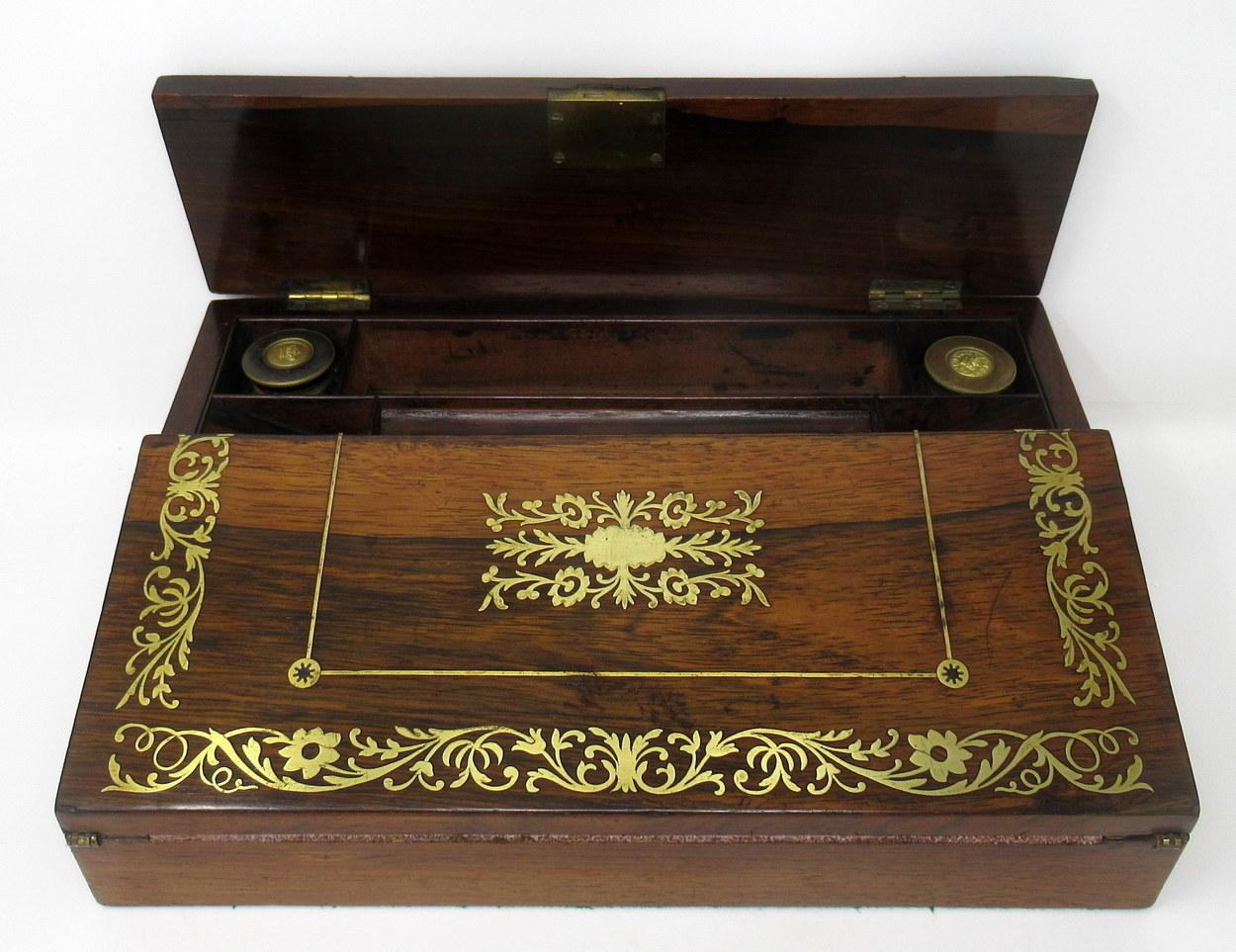 An exquisite example of an early rosewood writing slope of small proportions of English origin, circa first half of the 19th century probably French or English regency period.

The entire main area with lavish brass inlay on well figured rosewood