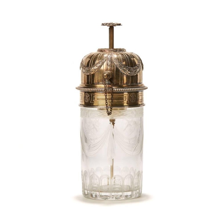 A stunning antique French silver mounted atomiser scent bottle with cut and finely engraved heavy glass base with scroll and small object designs with star cut base and with a silver mounted rim with a screw down atomiser domed cover. The atomised
