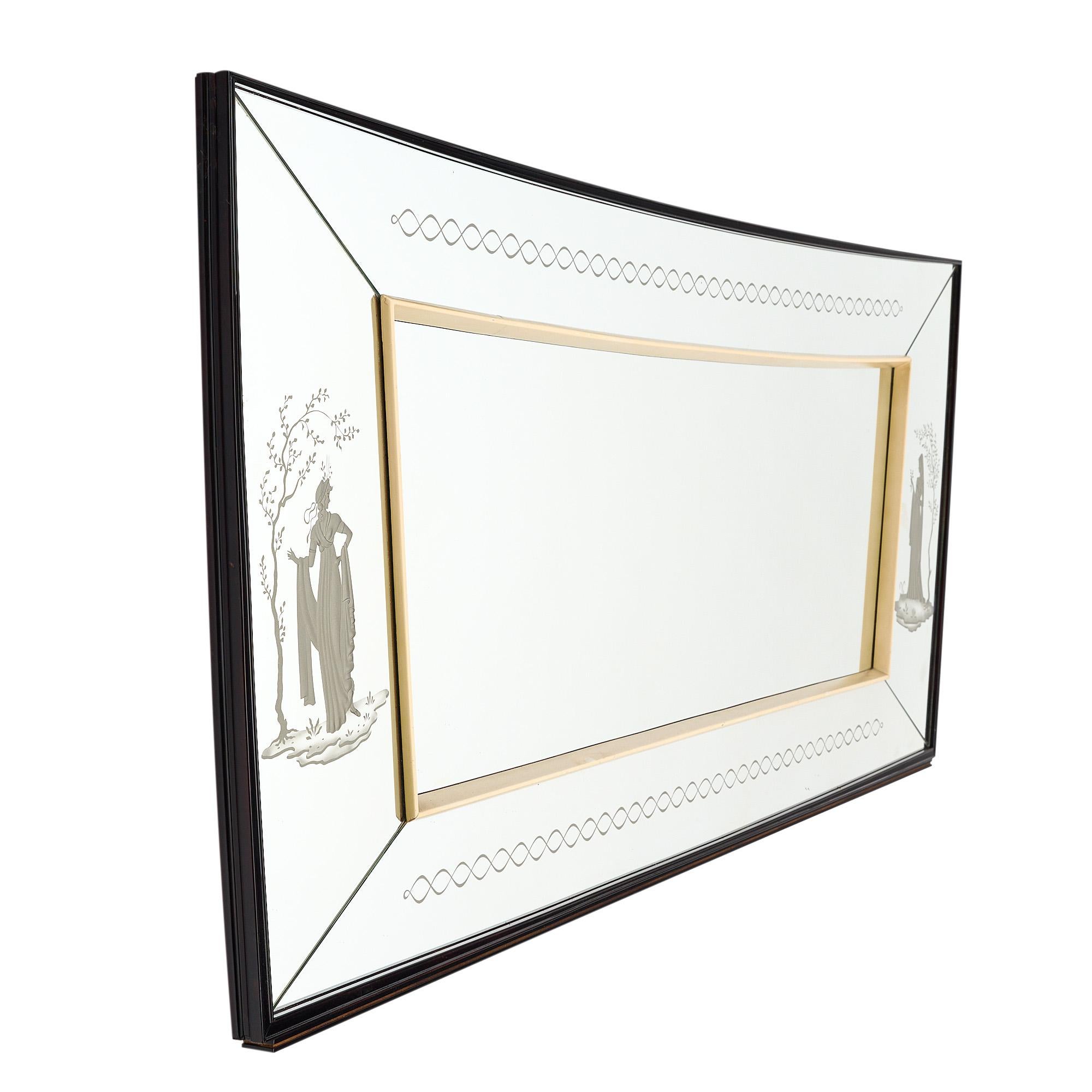 Grand mirror, French. This piece features an inside maple wood frame and engraved friezes featuring female figures. The length listed is at the widest point, at the narrowest point the length is 93.75”.
