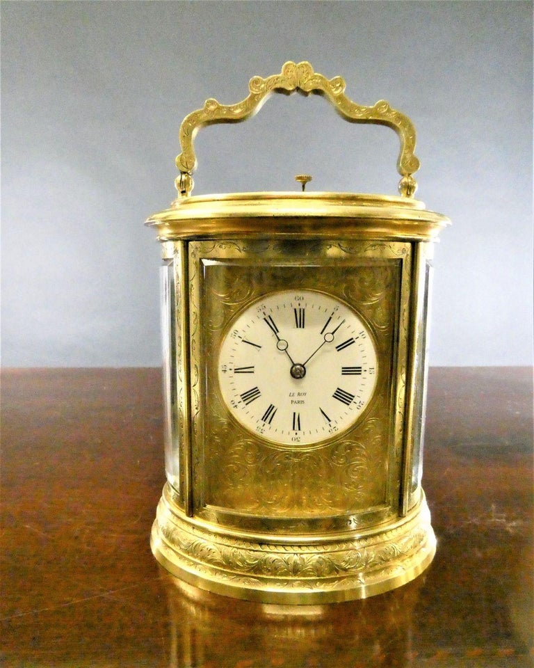 Fine engraved oval repeating carriage clock by Le Roy, Paris

Fine Victorian carriage clock in an ornately engraved gilded oval case with decorative carrying handle. Bevelled glass panels with an oval aperture to the top to view the original