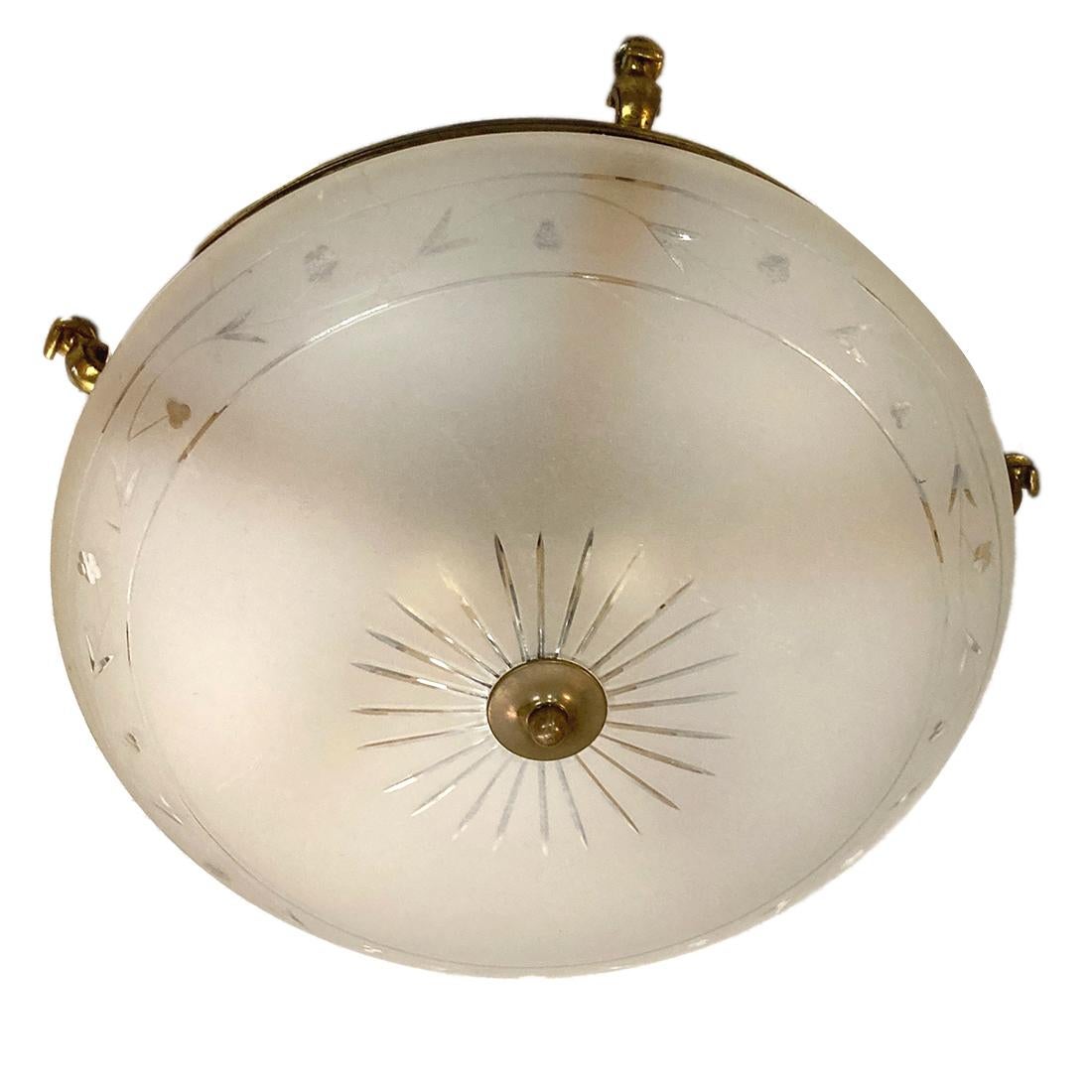 A circa 1920's French etched frosted glass flush mounted light fixture.

Measurements:
Diameter: 17
