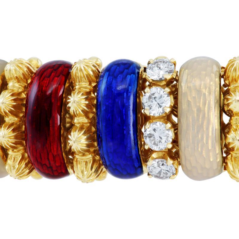 French European blue, ivory, red enamel stations and diamonds bracelet in 18K yellow gold. Round brilliant cut diamonds total approx. weight: 2.40 carats, estimate G-H color, VS clarity. Flexible bracelet total length 7.5 inches. Circa 1970s.