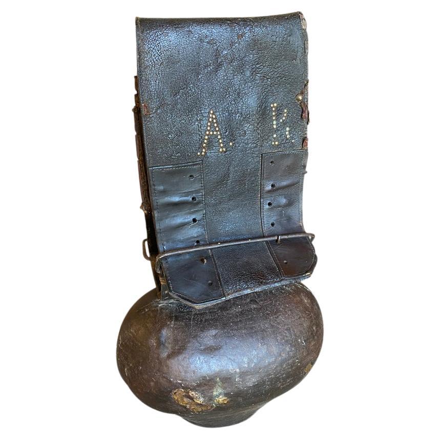 A very large French Cow bell crafted from leather and iron. The Cow Bell is dated 1805. A fabulous accent piece for any ranch or mountain home.