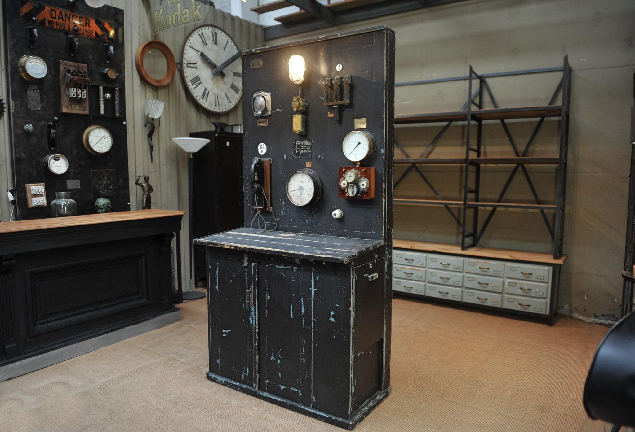 French factory cabinet with two front doors and one side sliding door in pine wood black painted, and top part is an electric switch board with manometer rewired light and Bakelite telephone, circa 1950s.