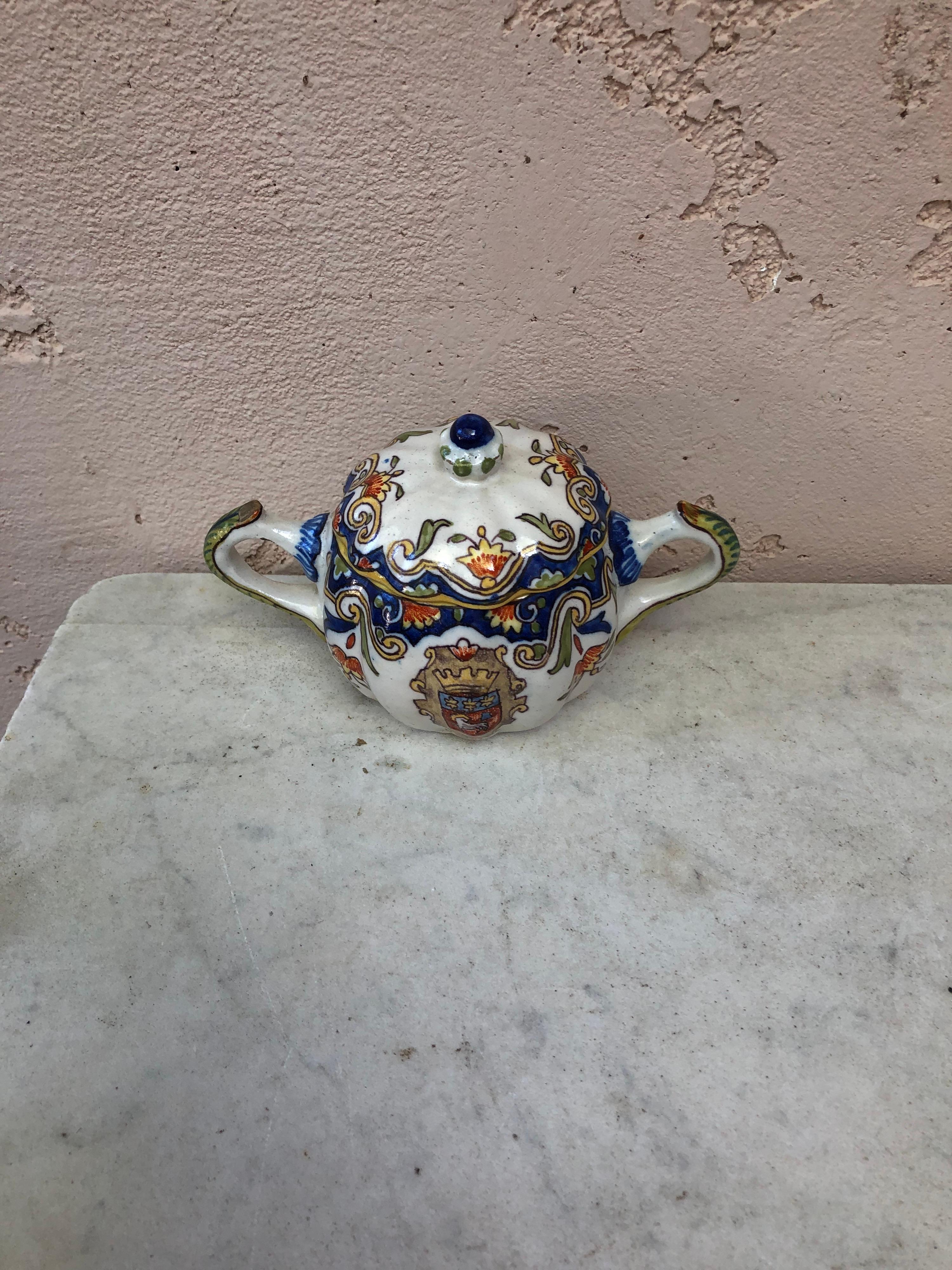 French faience covered handled bowl, circa 1900.
Coat of arms and floral pattern.