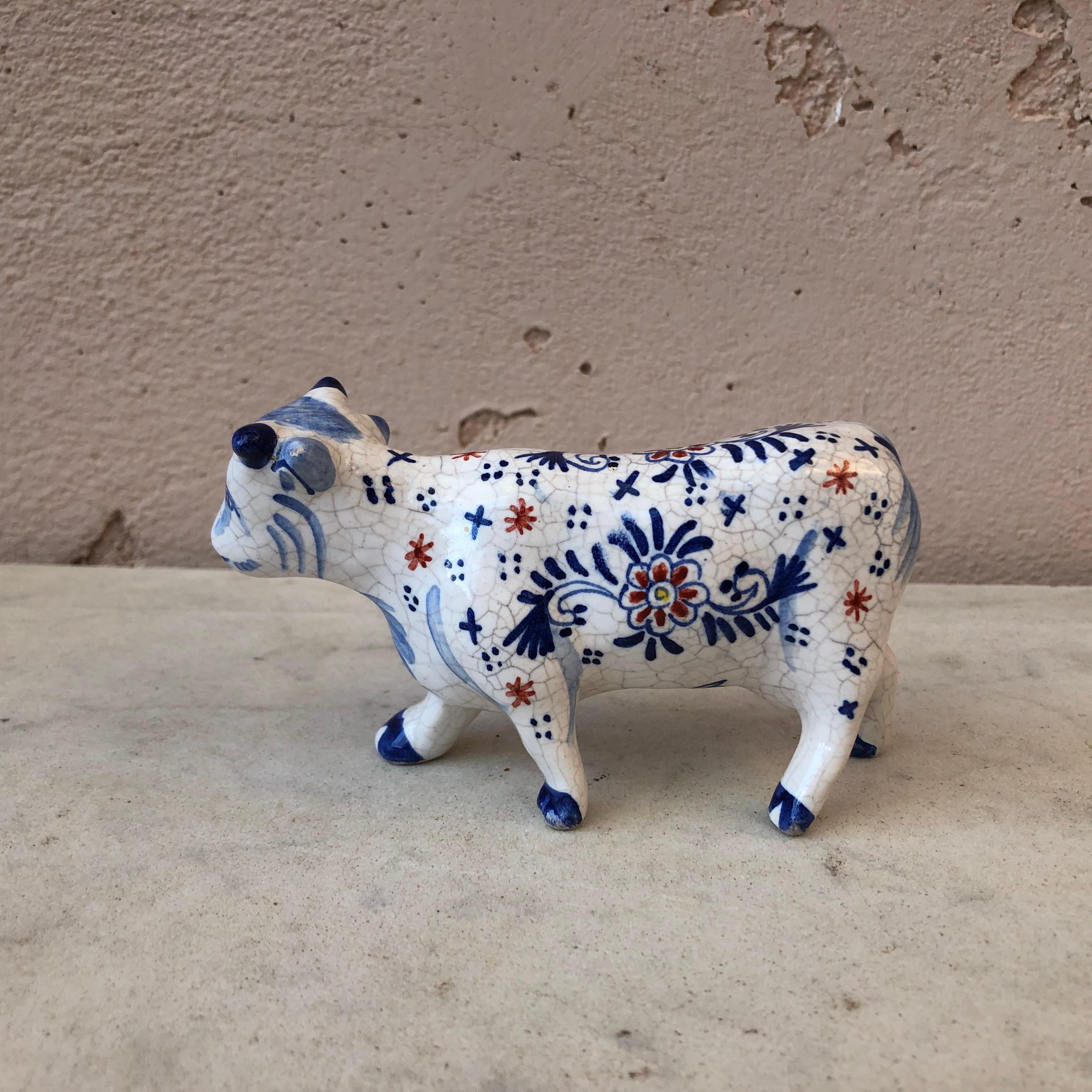 French faience blue and white cow attributed to Desvres, circa 1910.
  