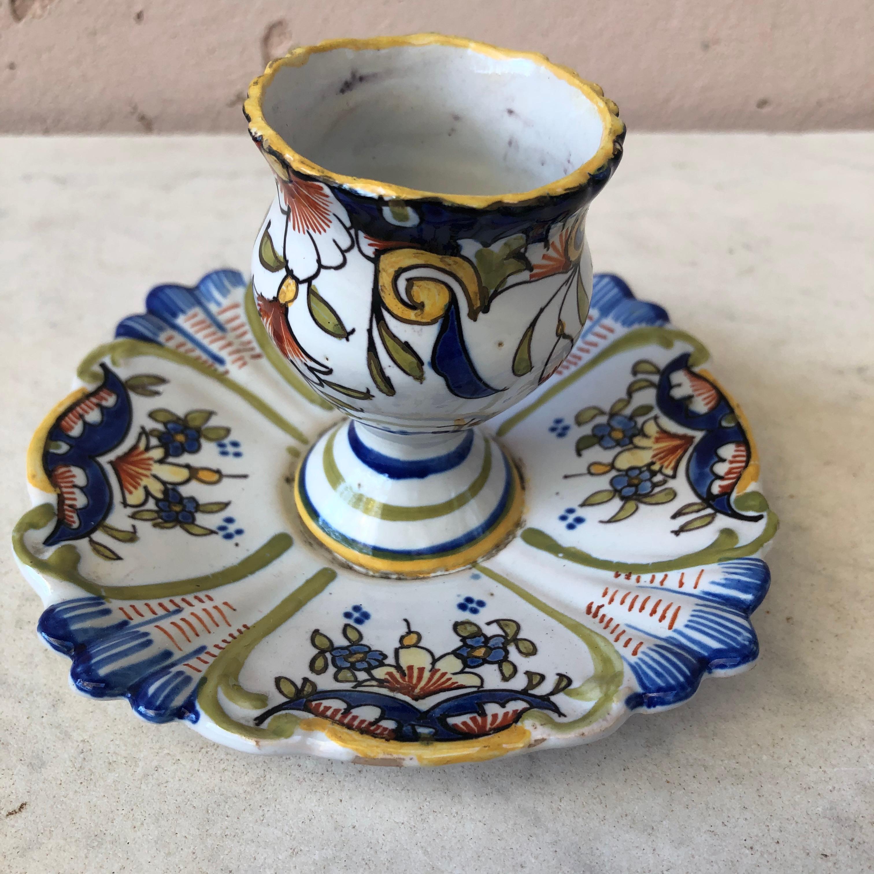 Rustic French Faience Egg cup signed Onival sur mer ( Normandy ) circa 1900.
Painted flowers pattern.
Desvres or Quimper style.