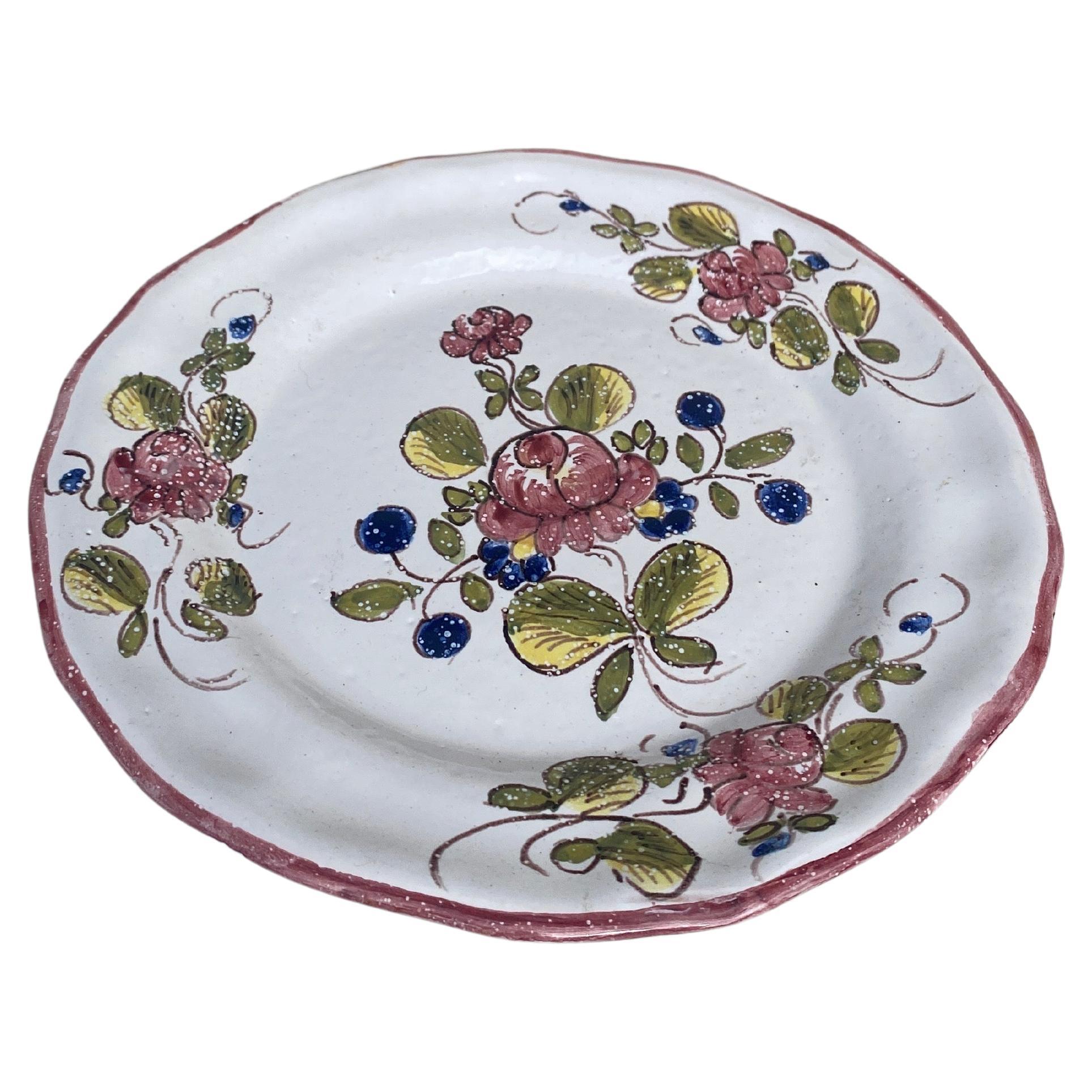 French faience plate with flowers Moustiers style Martres Tolosane, circa 1940.
 
