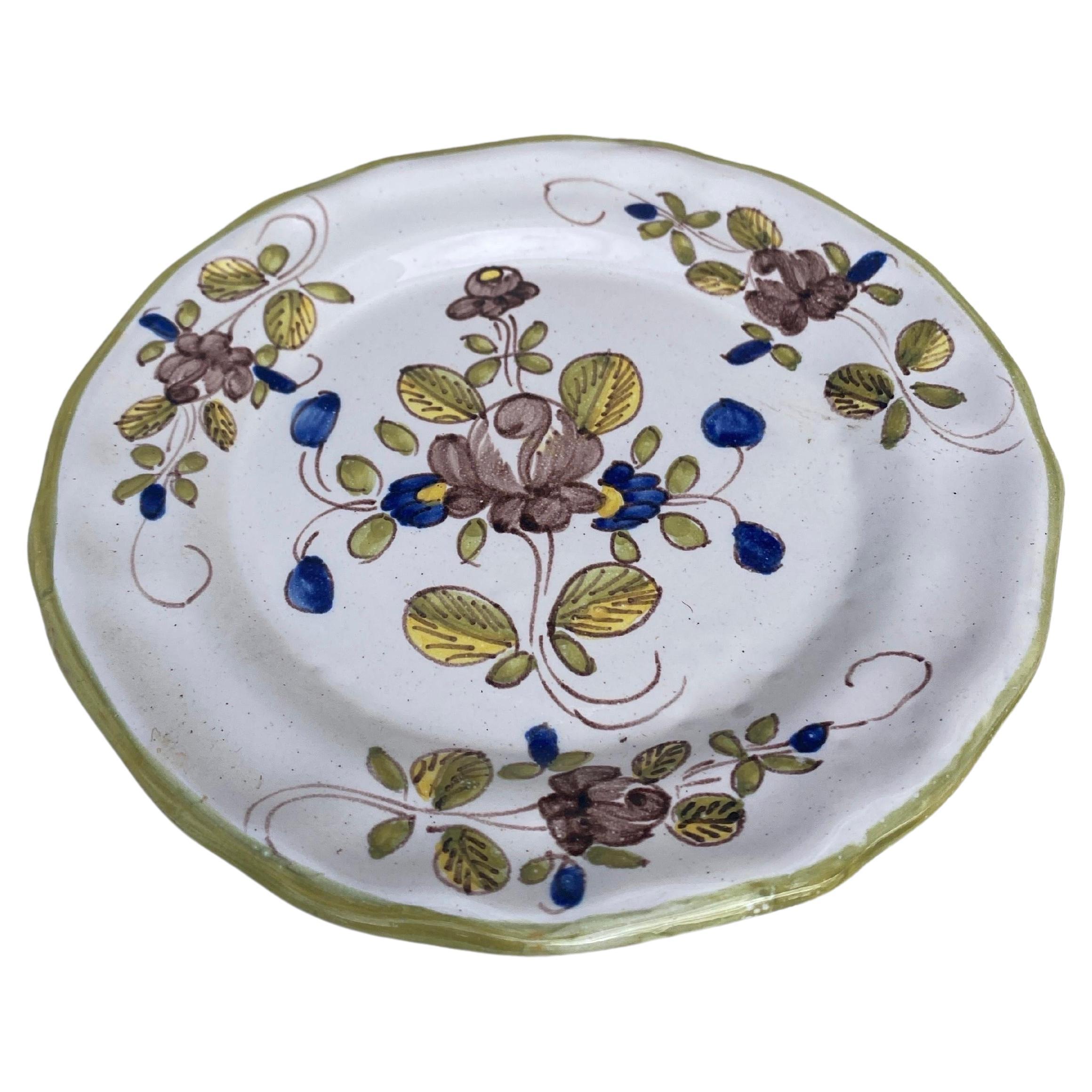 French faience plate with flowers Moustiers style Martres Tolosane, circa 1940.
 
