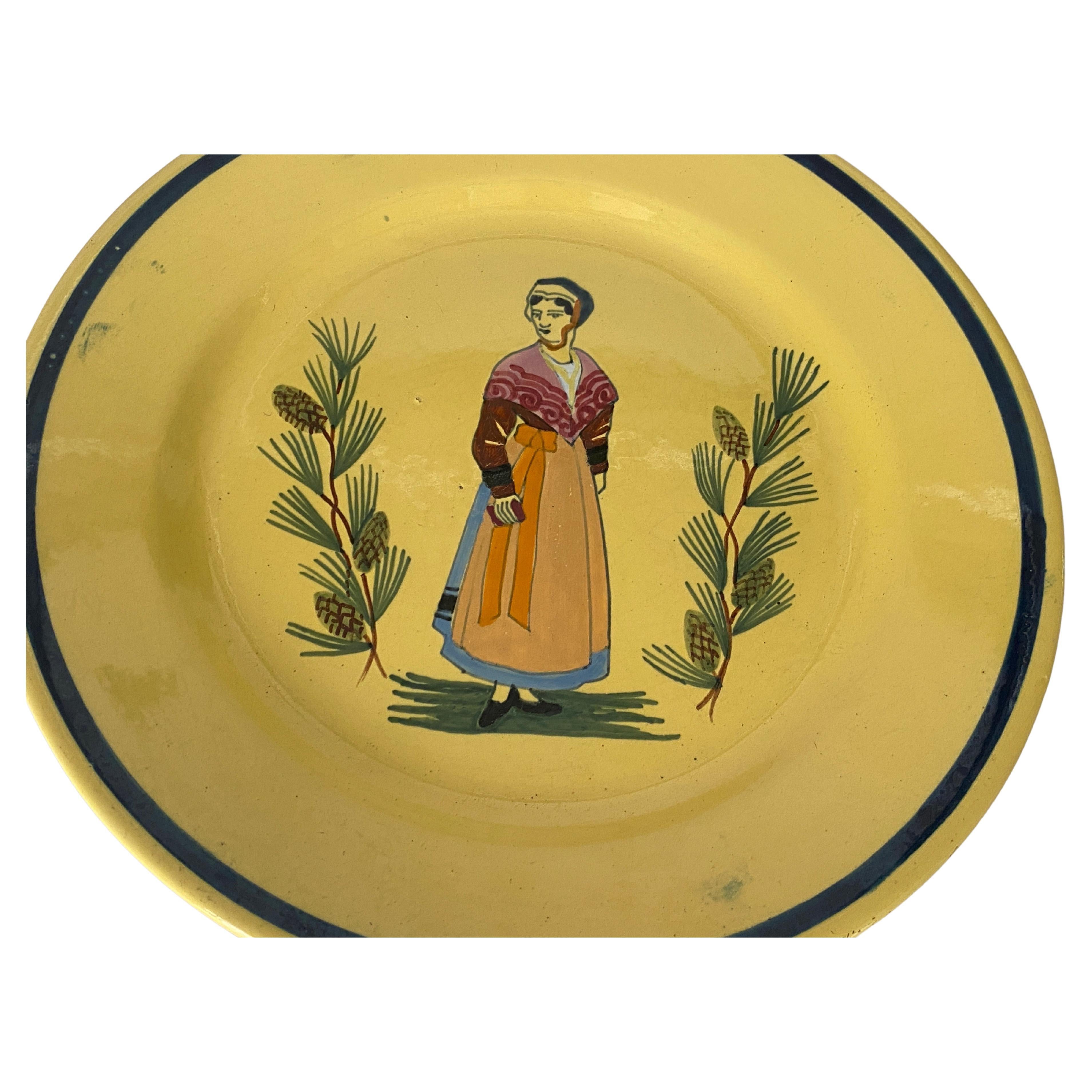 Yellow plate in Faience. It has been made in France in the 10th century. It is hand painted.
With Olive and a cricket pattern decoration.
signed by Etienne Laget