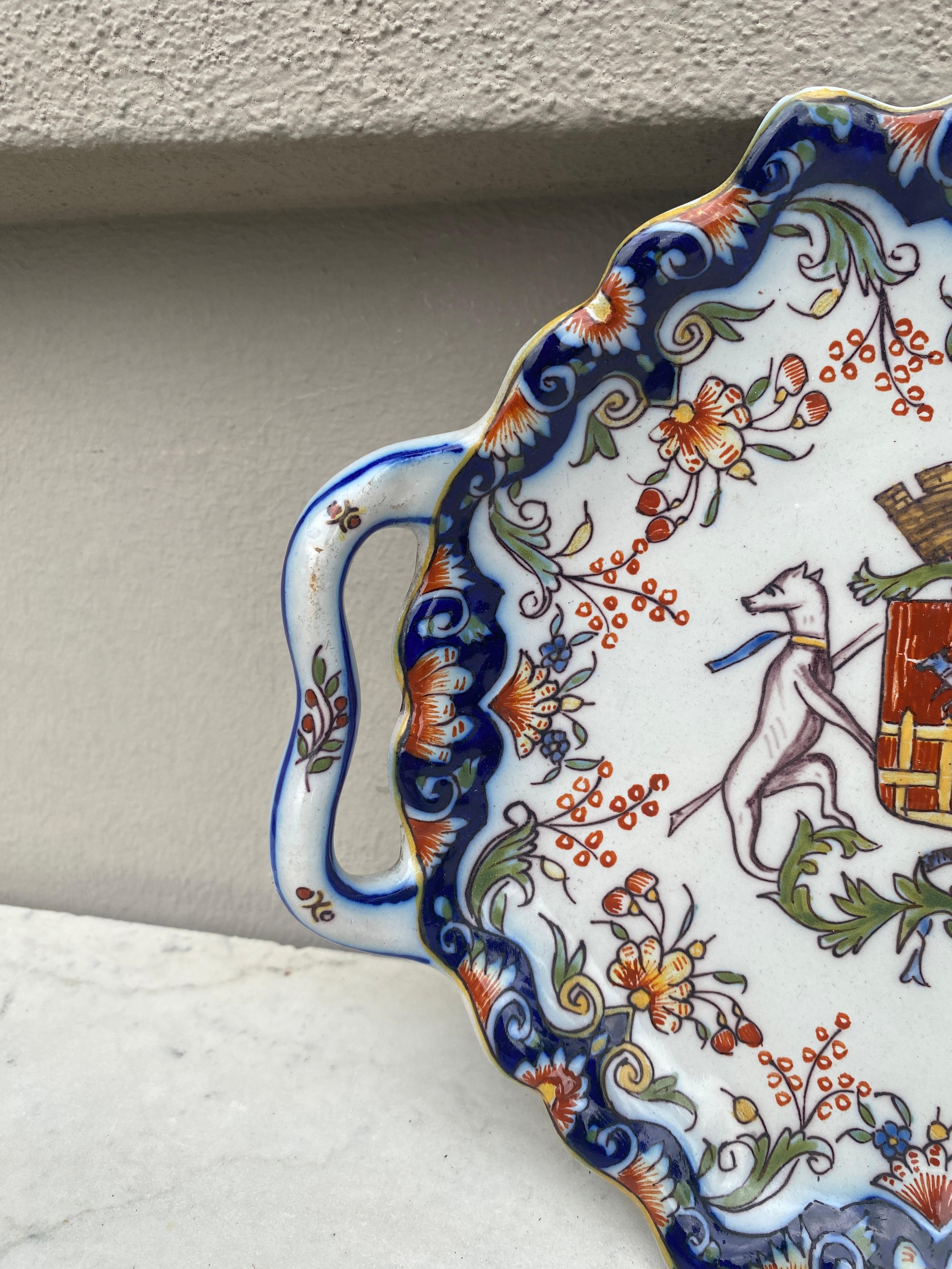 Antique French faience handled platter coat of arms wth dogs and floral pattern, circa 1900. 