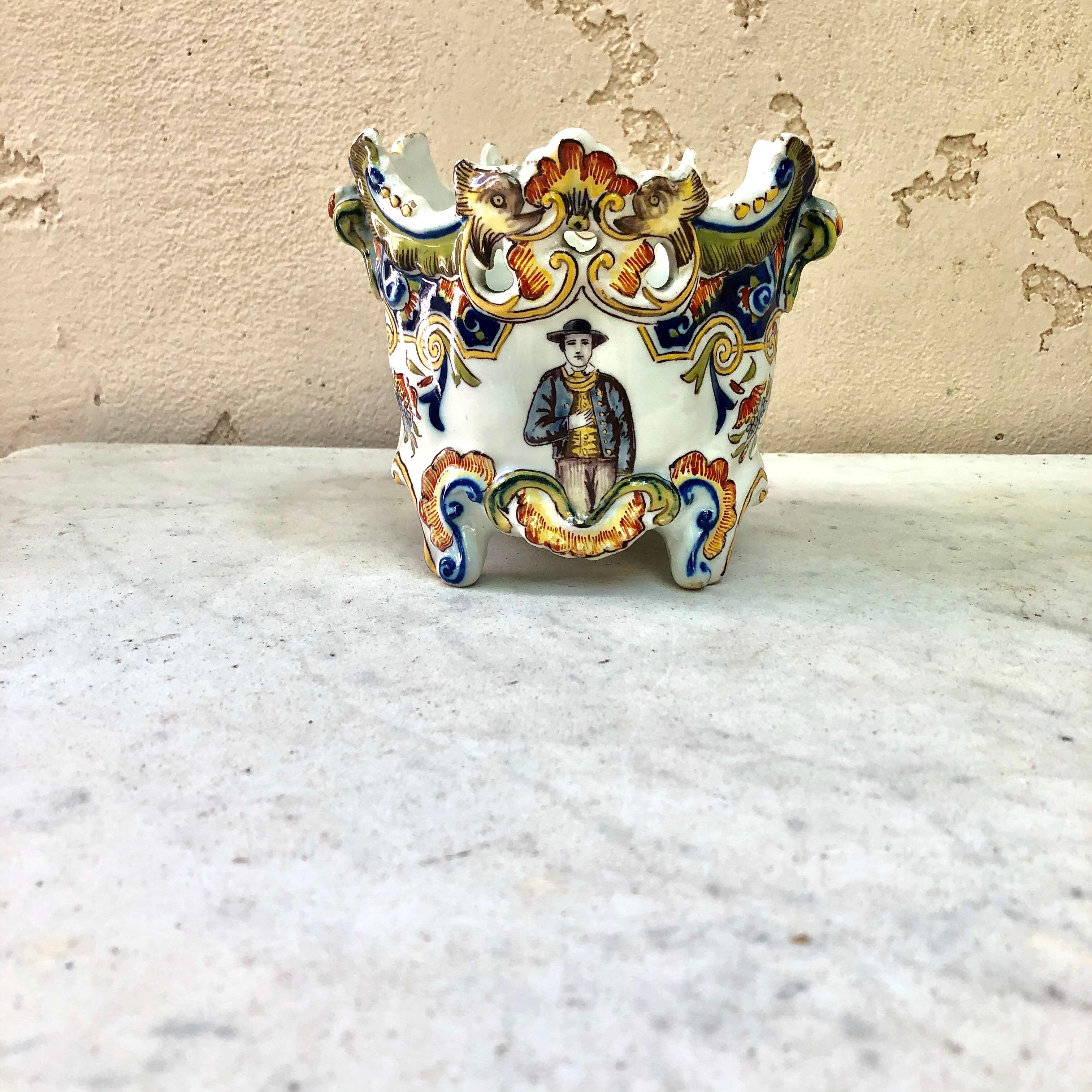 French Desvres faience jardinière cachepot painted with flowers, coat of arms and a farmer, circa 1900.