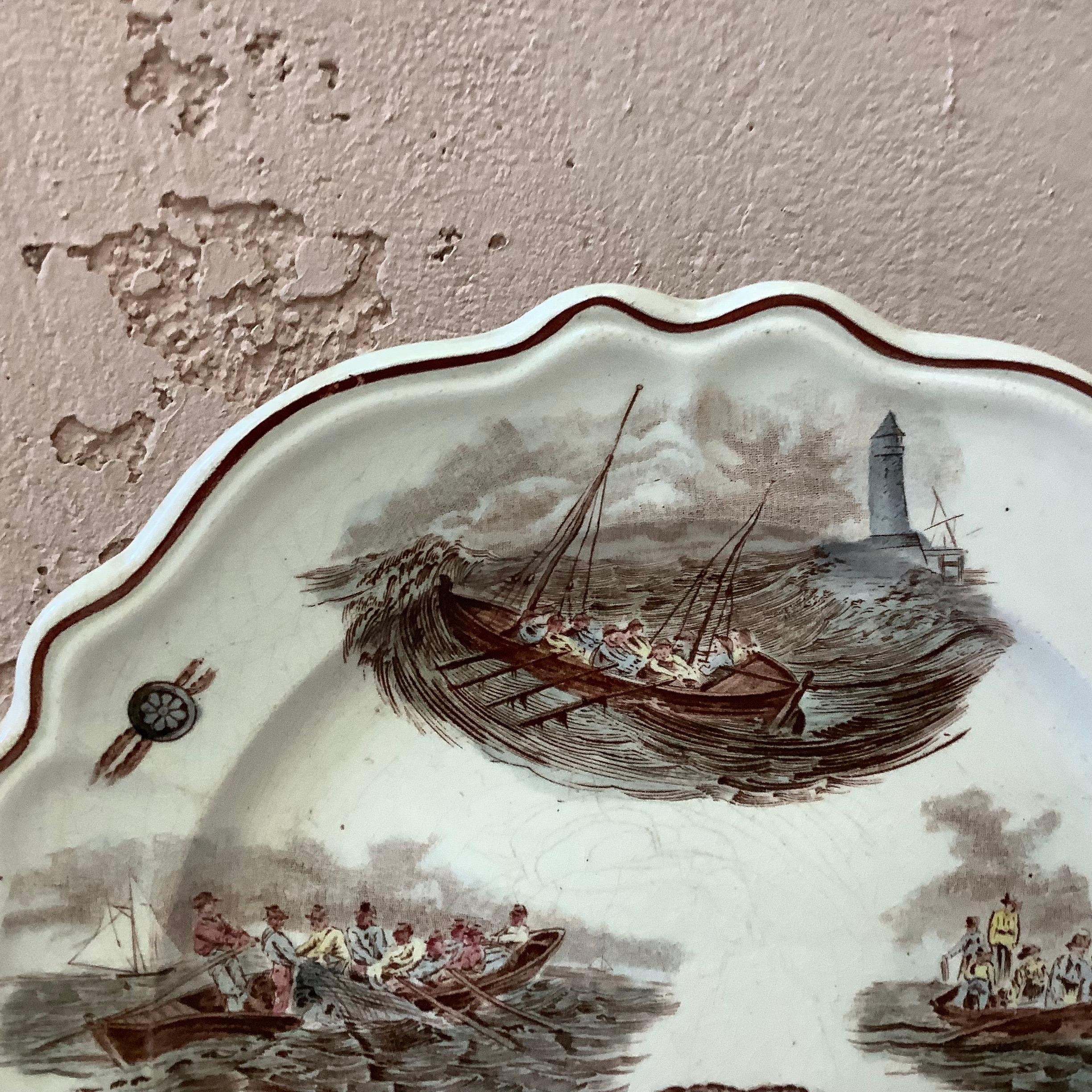 Large 19th French decorative plate with nautical pattern (boats, fishs baskets, lighthouse), circa 1900.