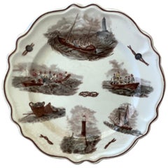 Assiette à motifs nautiques en faïence française, vers 1900