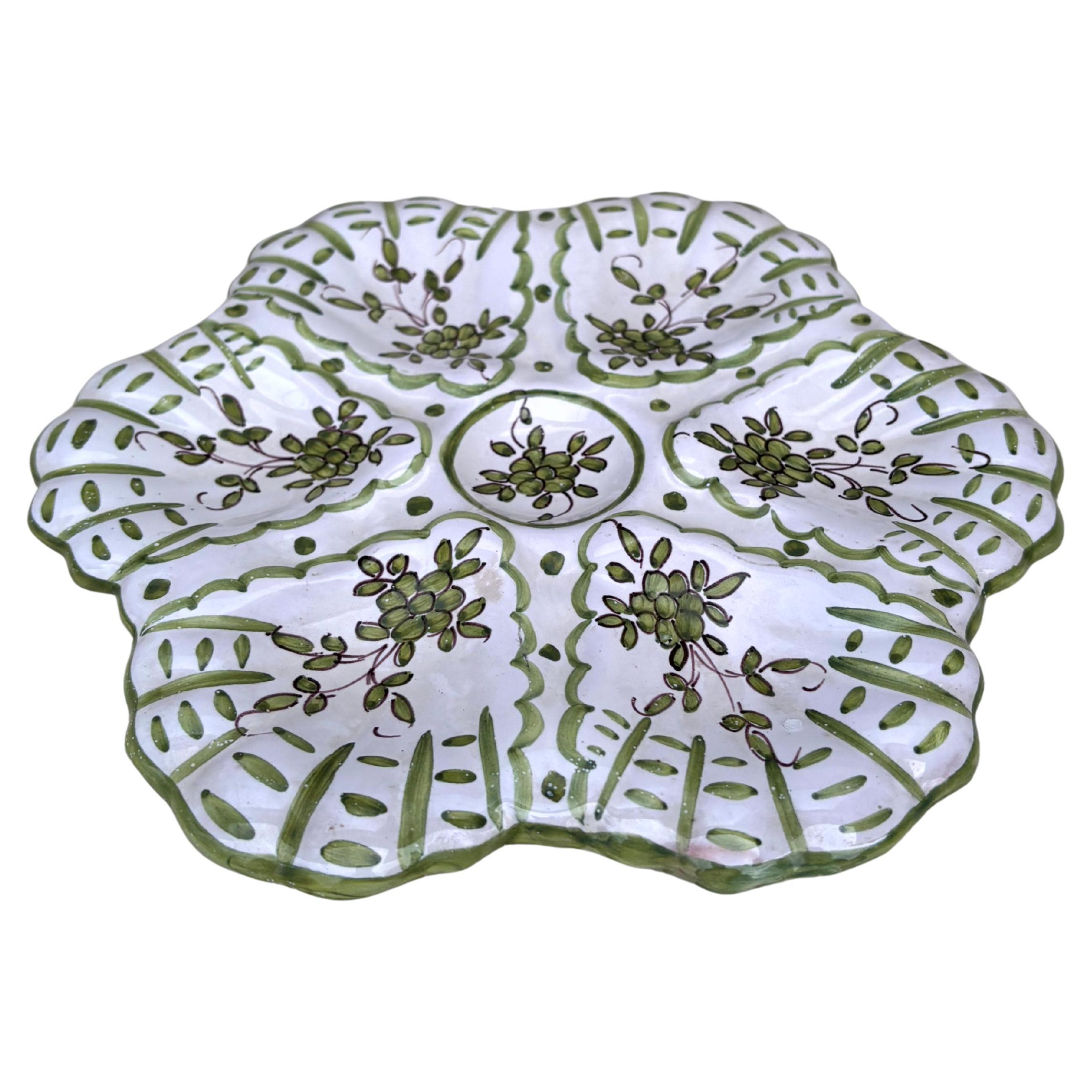 French faience oyster flowers plate Moustiers style signed Martres Tolosane, circa 1940.
 