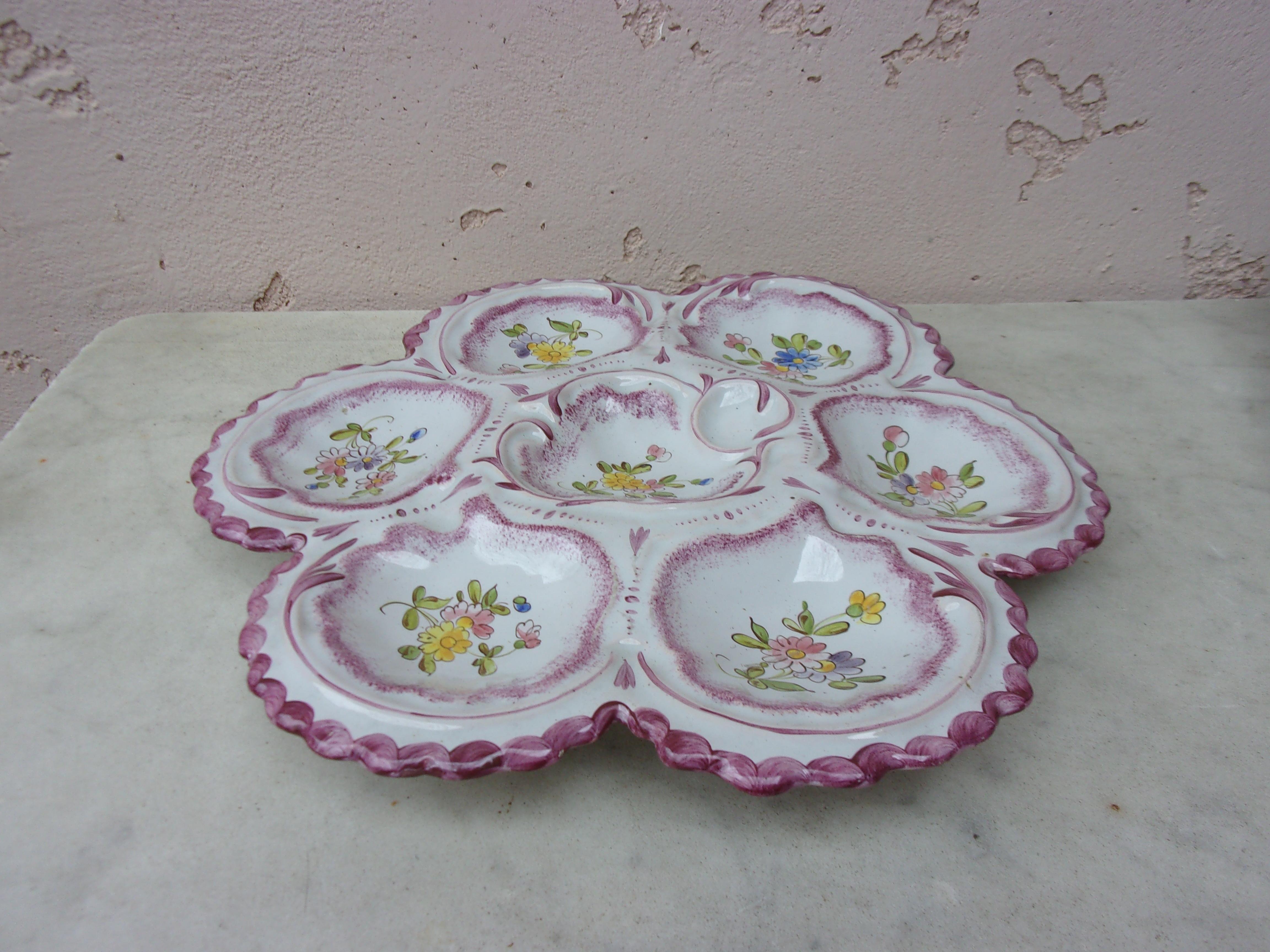 Lovely large French faience oyster plate in pastel colors with flowers, circa 1900 signed Alfred Renoleau Angouleme.