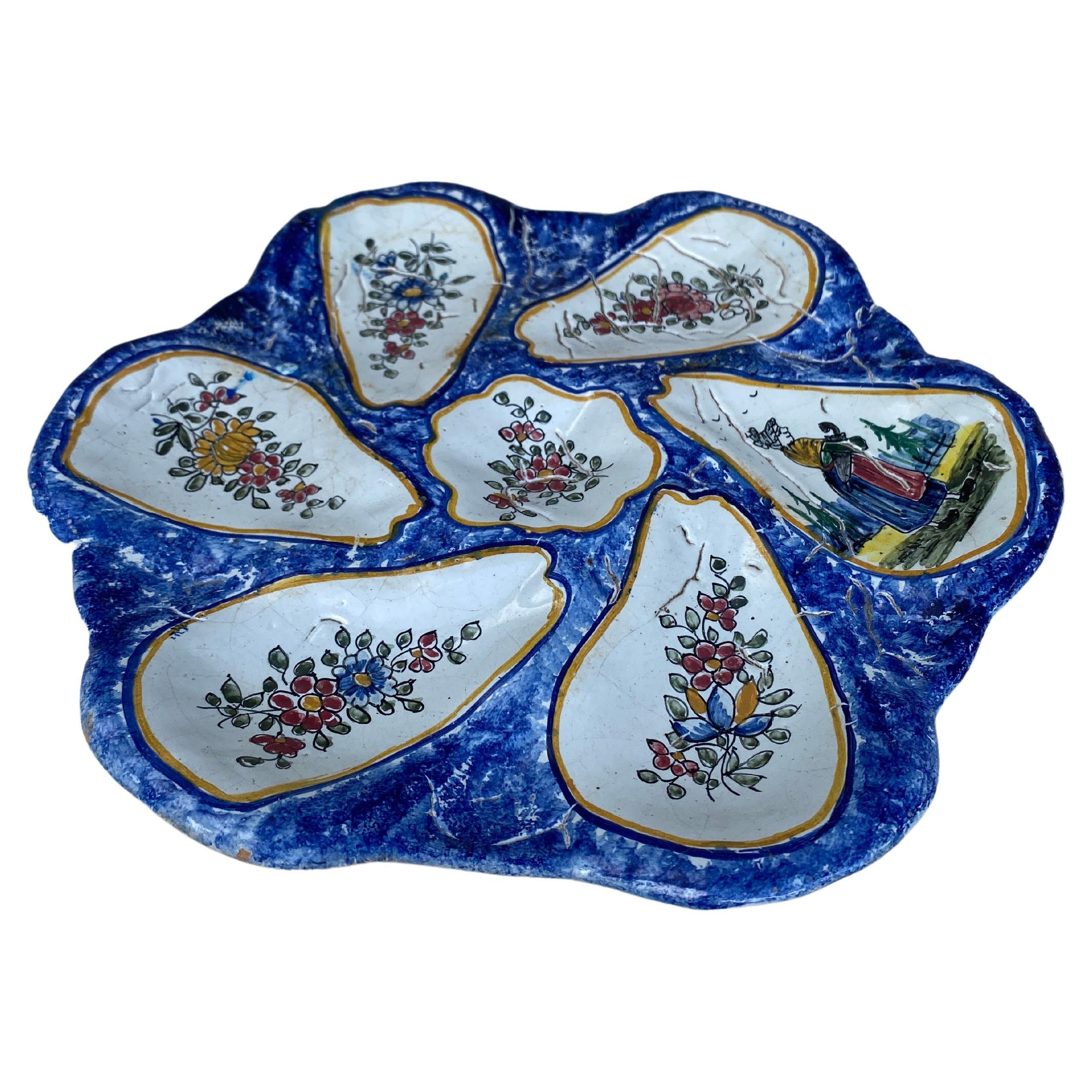 French rustic faience oyster plate with flowers and bretonne circa 1920.