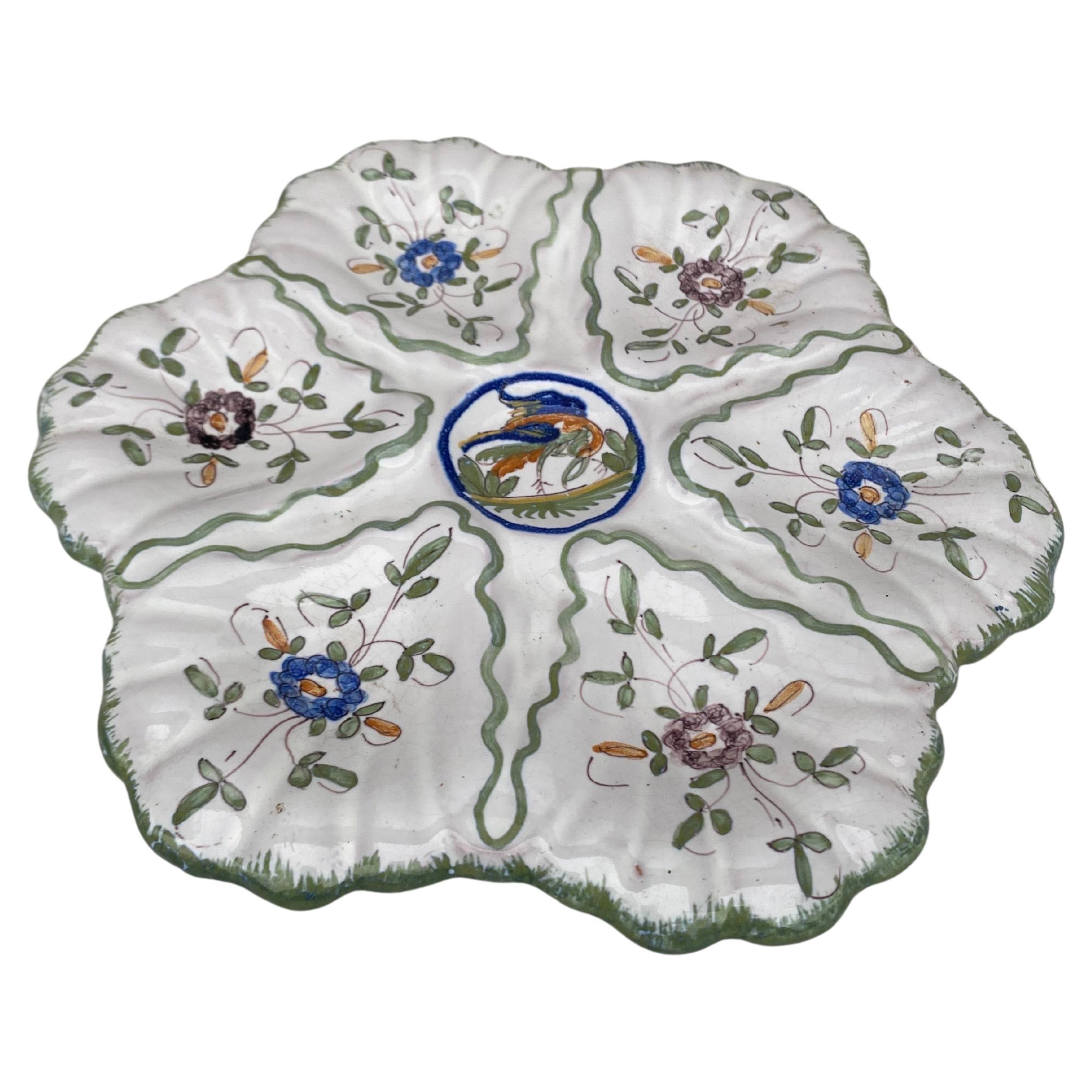 French Faience rustic oyster plate Moustiers style, circa 1940.
Painting of birds and flowers.