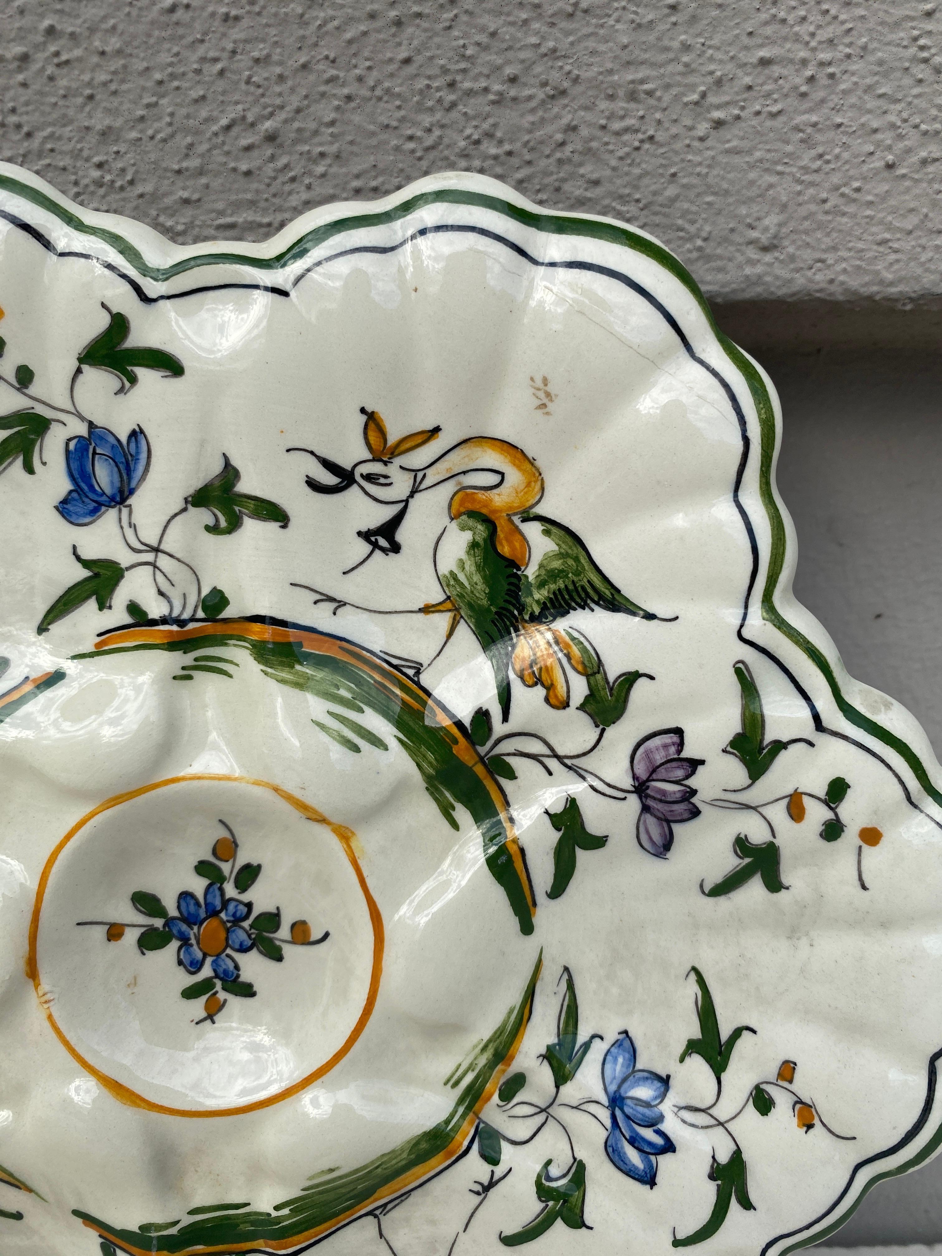 French Faience rustic oyster plate Moustiers style, circa 1940.
Painting of birds and flowers.