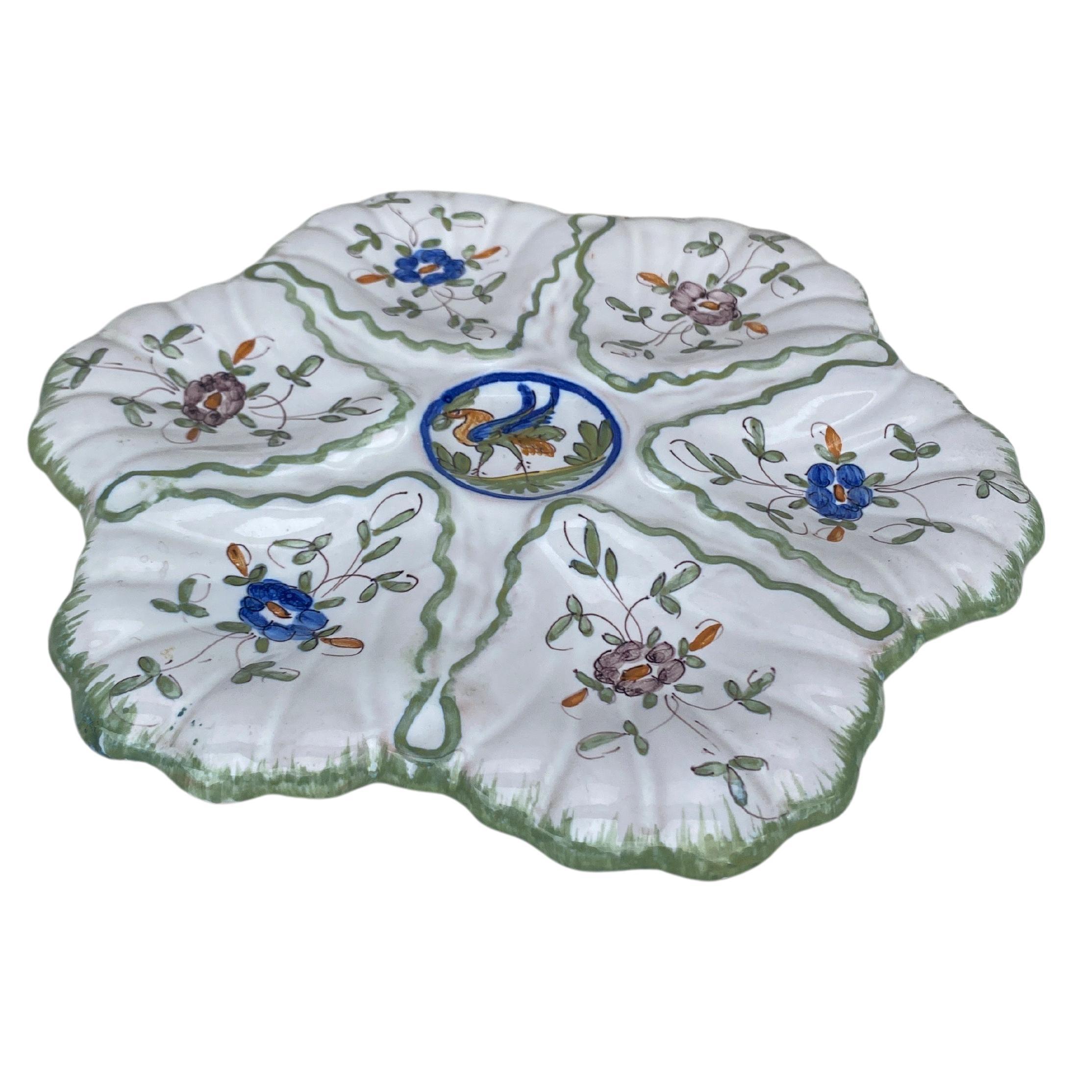 French faience oyster plate with Bird Moustiers style signed Martres Tolosane, circa 1940.
 