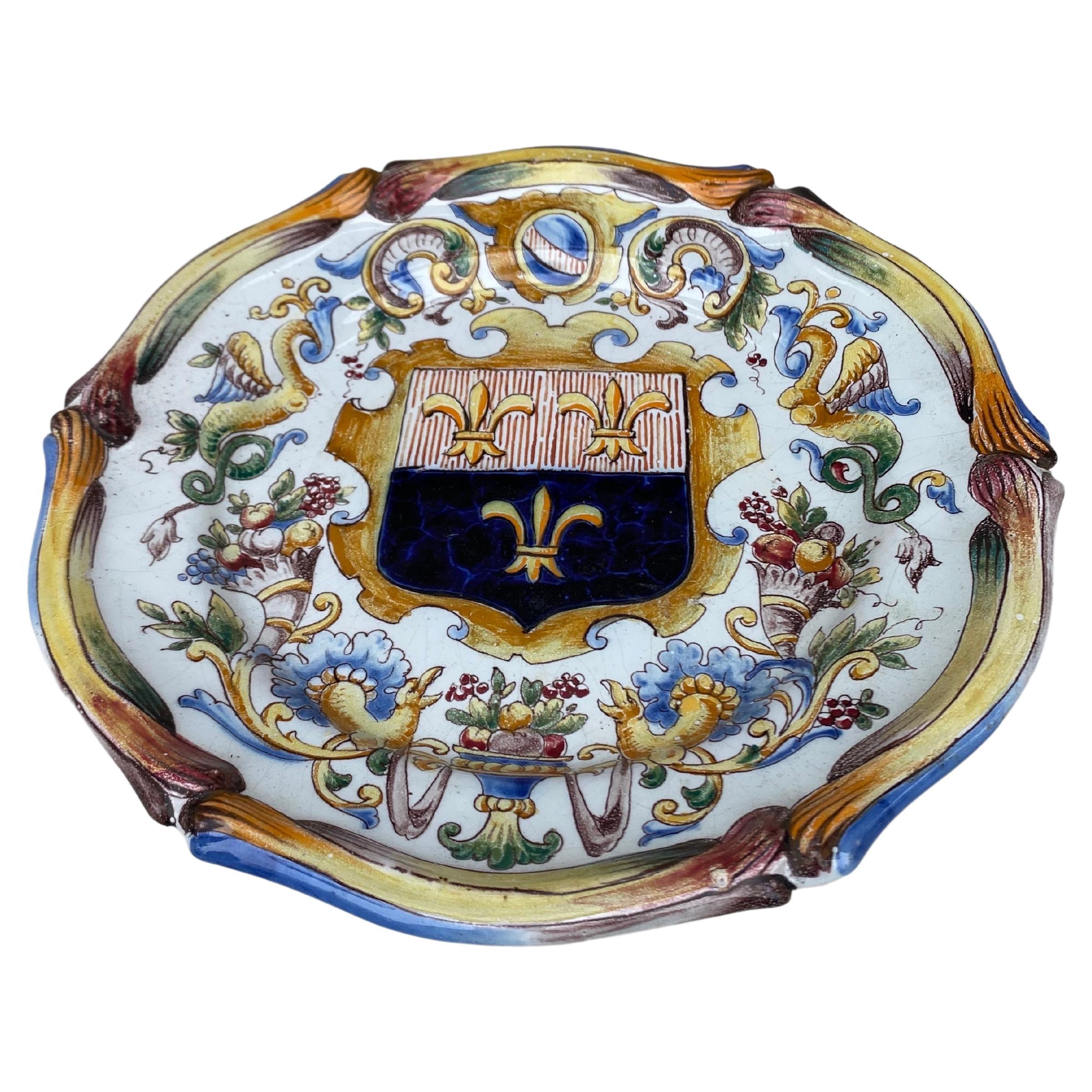 French Faience plate signed Saint Clement Circa 1900.
Decorated with cornucopia and coat of arms with Fleur de lis on the center.