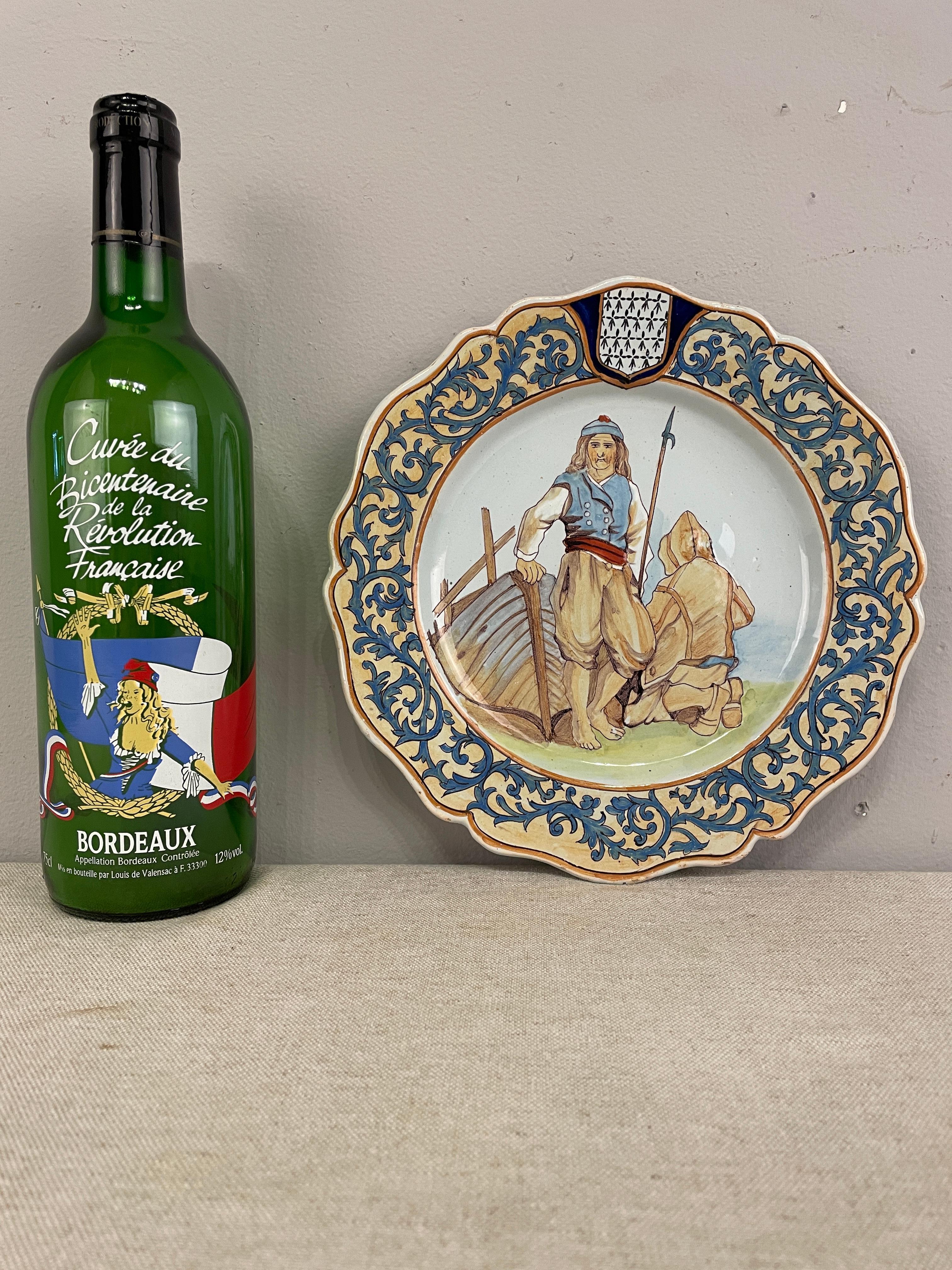 A good 1950's French Quimper Faience plate depicting two fishermen, with soft color. In good condition with minor wear.
9.25