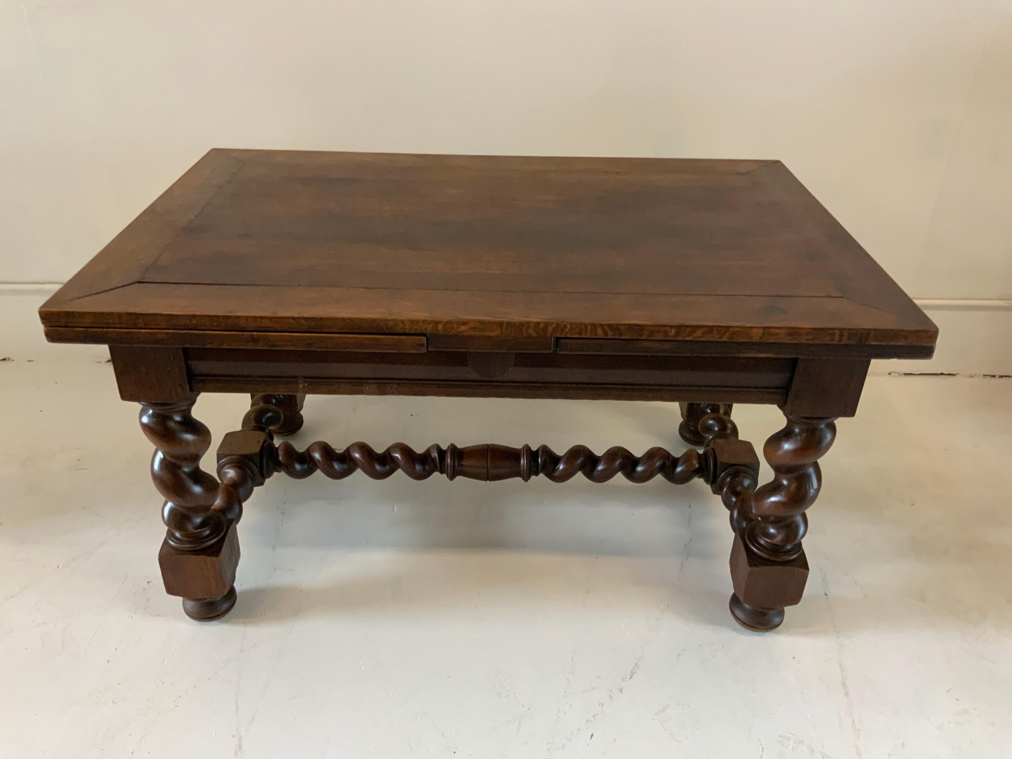 French farm trestle dining table Henry II style, varnished with 2 slide out leaves. This table comes from the North of France.
Table leaf width 23