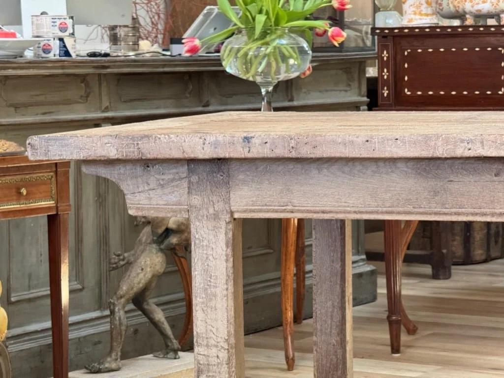 Outstanding large, rectangular French farm Table, 19th Century, a lovely light tone cerused oak, fully pegged, having a two-board top with bread board ends, over a shallow skirt above four square legs joined by a central and t-stretchers.  Perfect