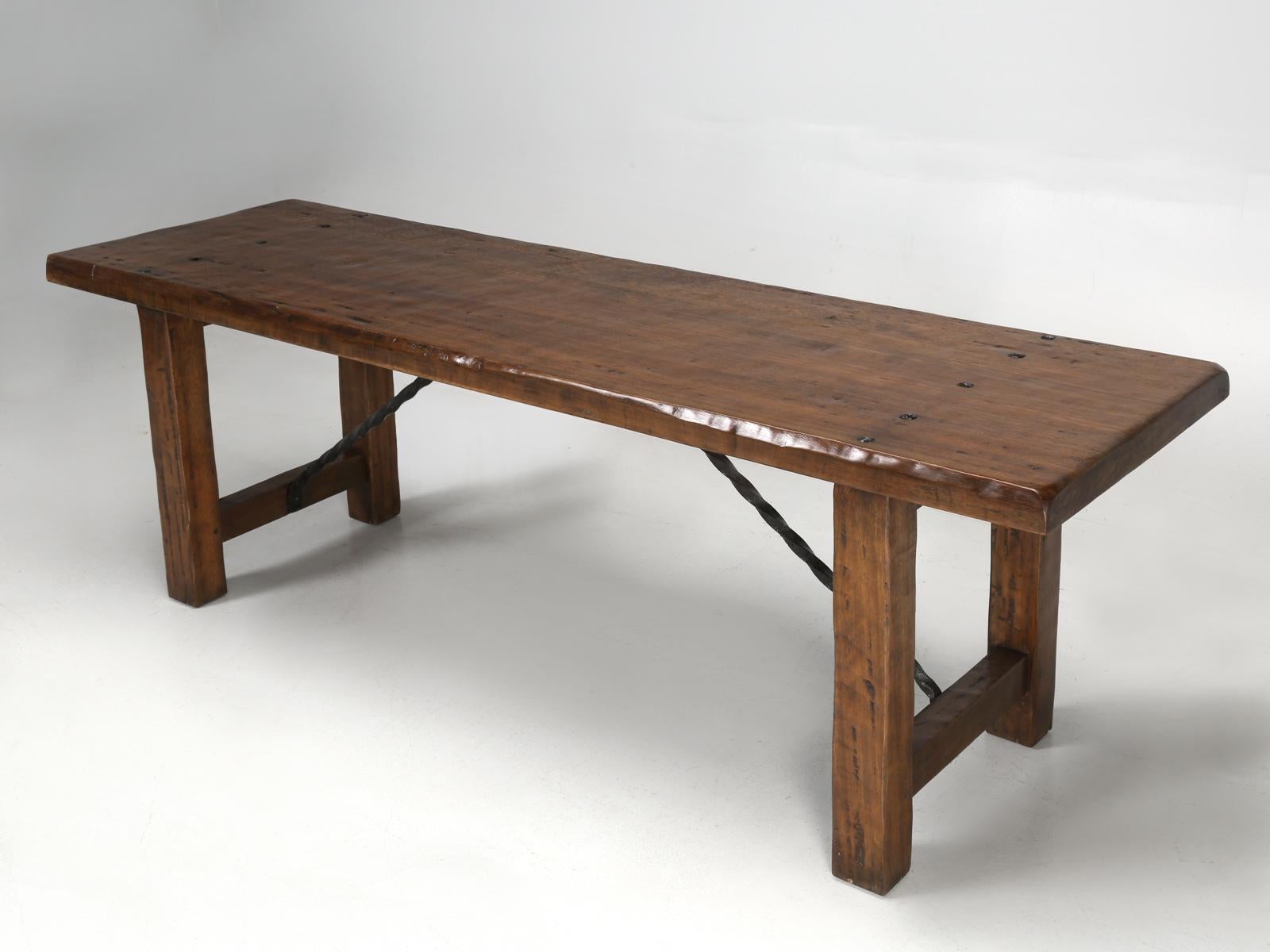 French farm table with a pair of matching French benches. We just received this particular French farm table and it arrived in a dreadful red stain, so, our old plank finishing department, hand-scraped the French farm table and the matching French