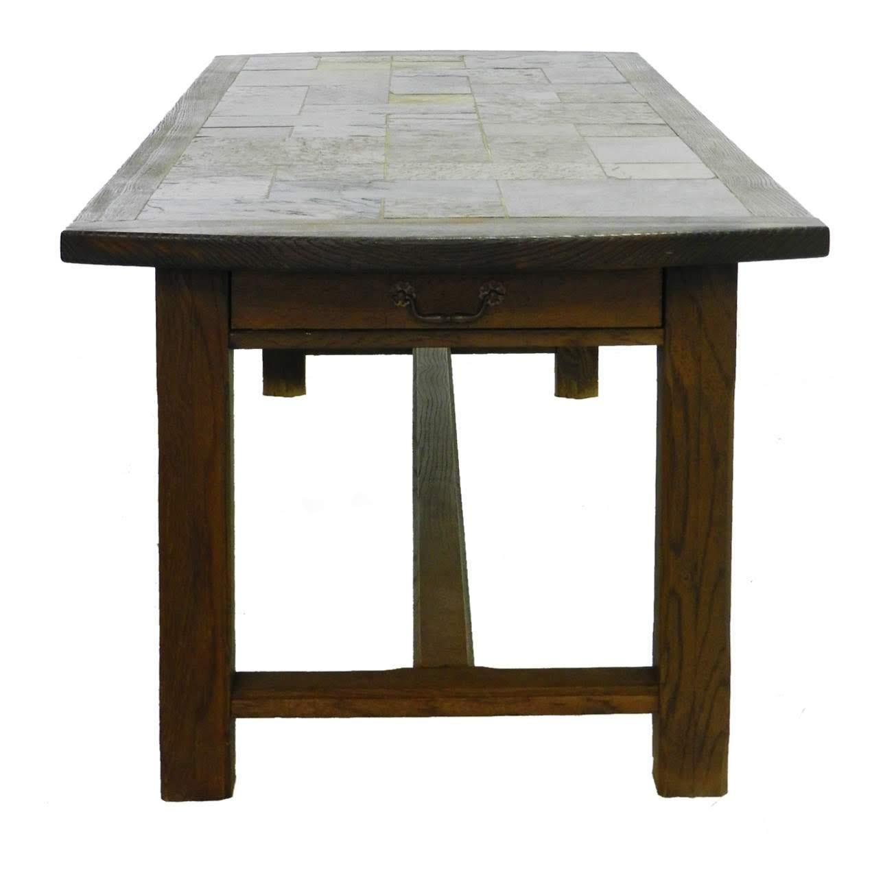 French farm table inset stone tiles vintage 20th century Shaker style one of a kind
Single drawer one end
Unusual Artisan made table with French Ardoise stone tiled top of varying hues
Dismantles for shipping and placing in situ
Solid chestnut wood