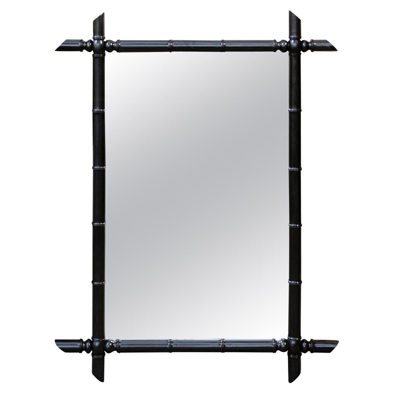 French Faux Bamboo Black Painted Mirror with Protruding Corners from the 1920s