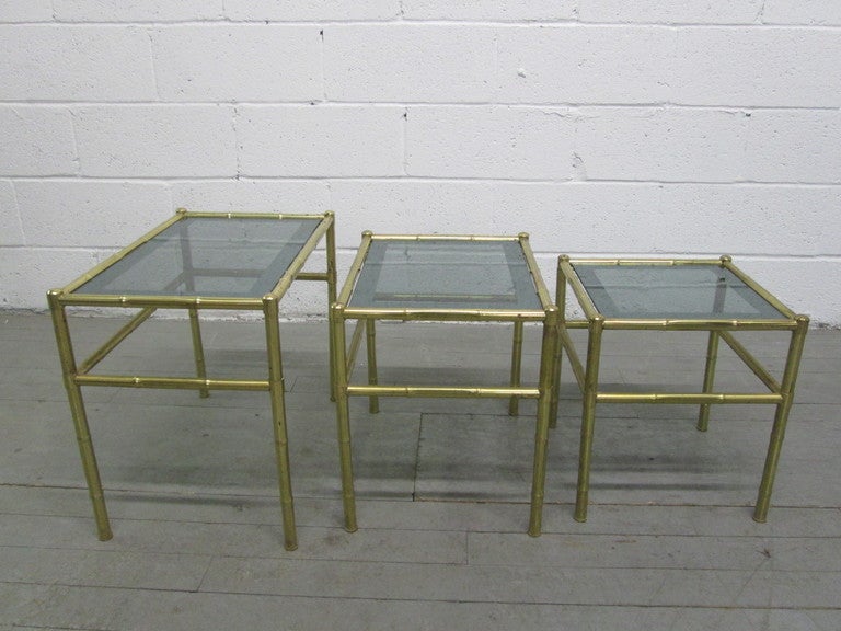 Brass French nesting tables with smoked glass tops. Maison Baguès style. Large measures: 21.5