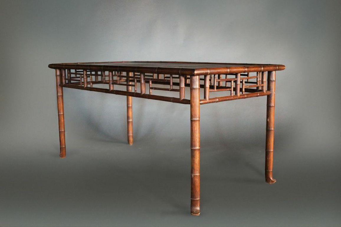 French faux bamboo dining table, made of hard wood carved to imitate Asian style and materials.  Distance between skirt and floor 22 3/4