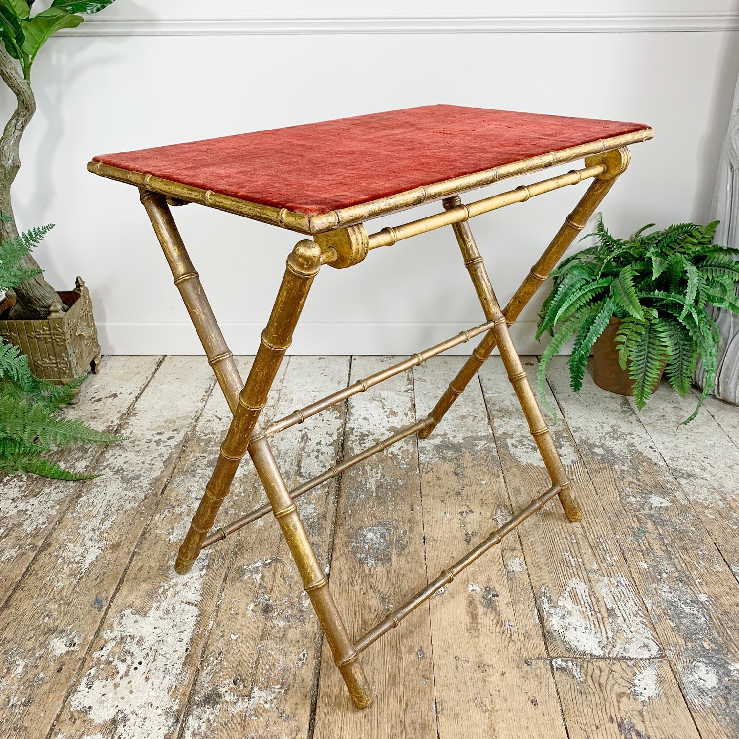 Beautiful late 19th century French faux bamboo card table, original red velvet top, the giltwood legs and top fold flat so it can be easily stored, perfect for late night poker or as an elegant occasional table.

The red velvet top has obvious