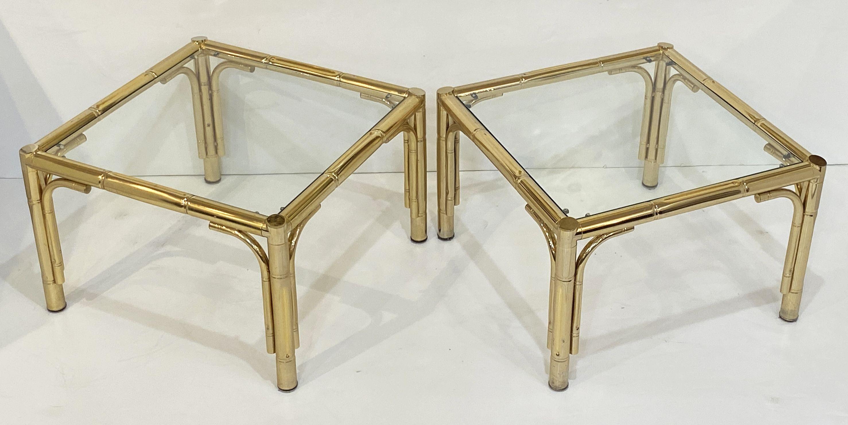 A fine pair of vintage French square low tables in brass with a handsome faux bamboo design to the frames - each table featuring an inset glass top over four legs.

Perfect for use as side or end tables or placed together as coffee of cocktail