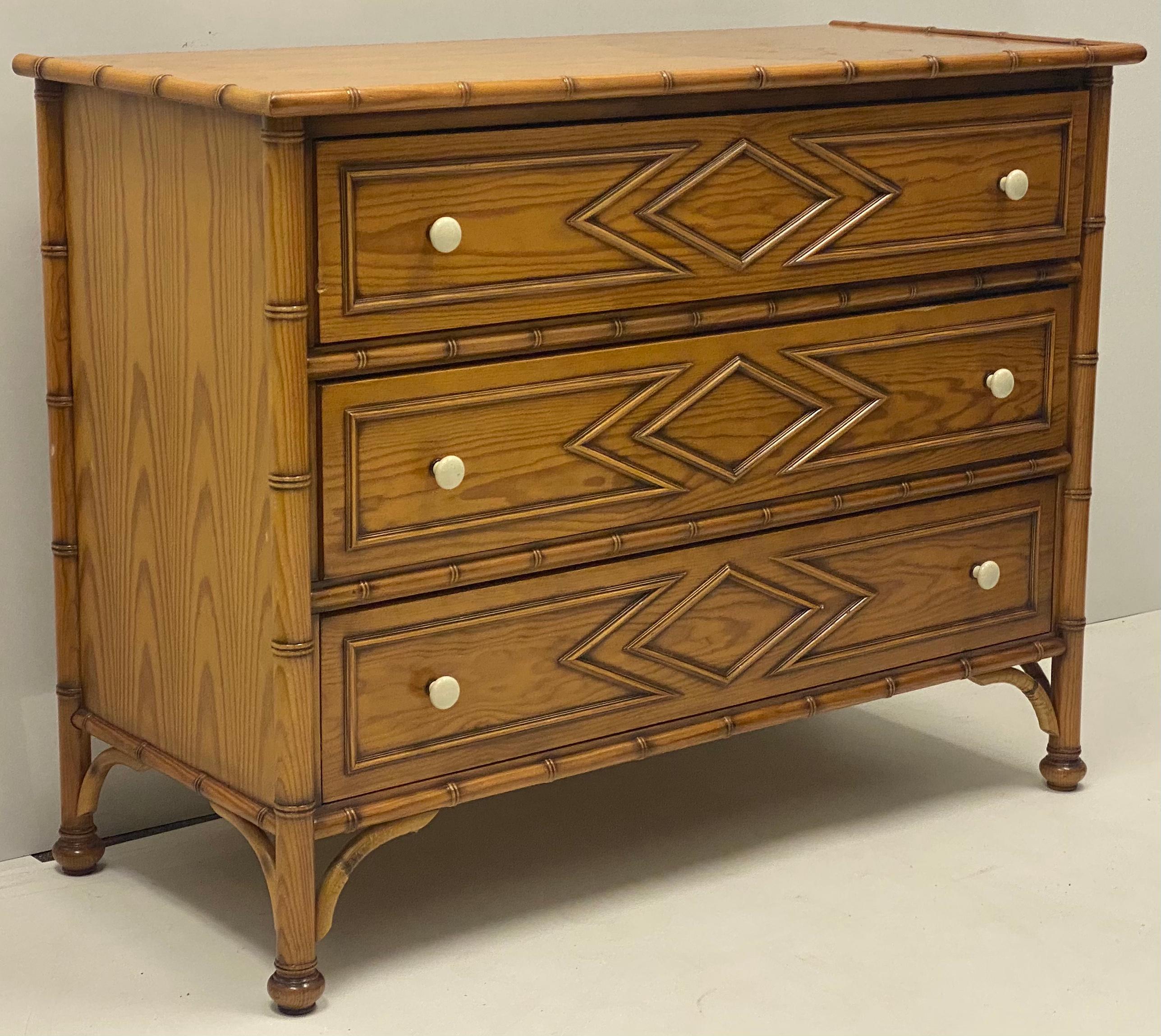 This is a wonderful 20th century faux bamboo chest by Grange. The wood appears to be maple, and the porcelain pulls are in very good condition.