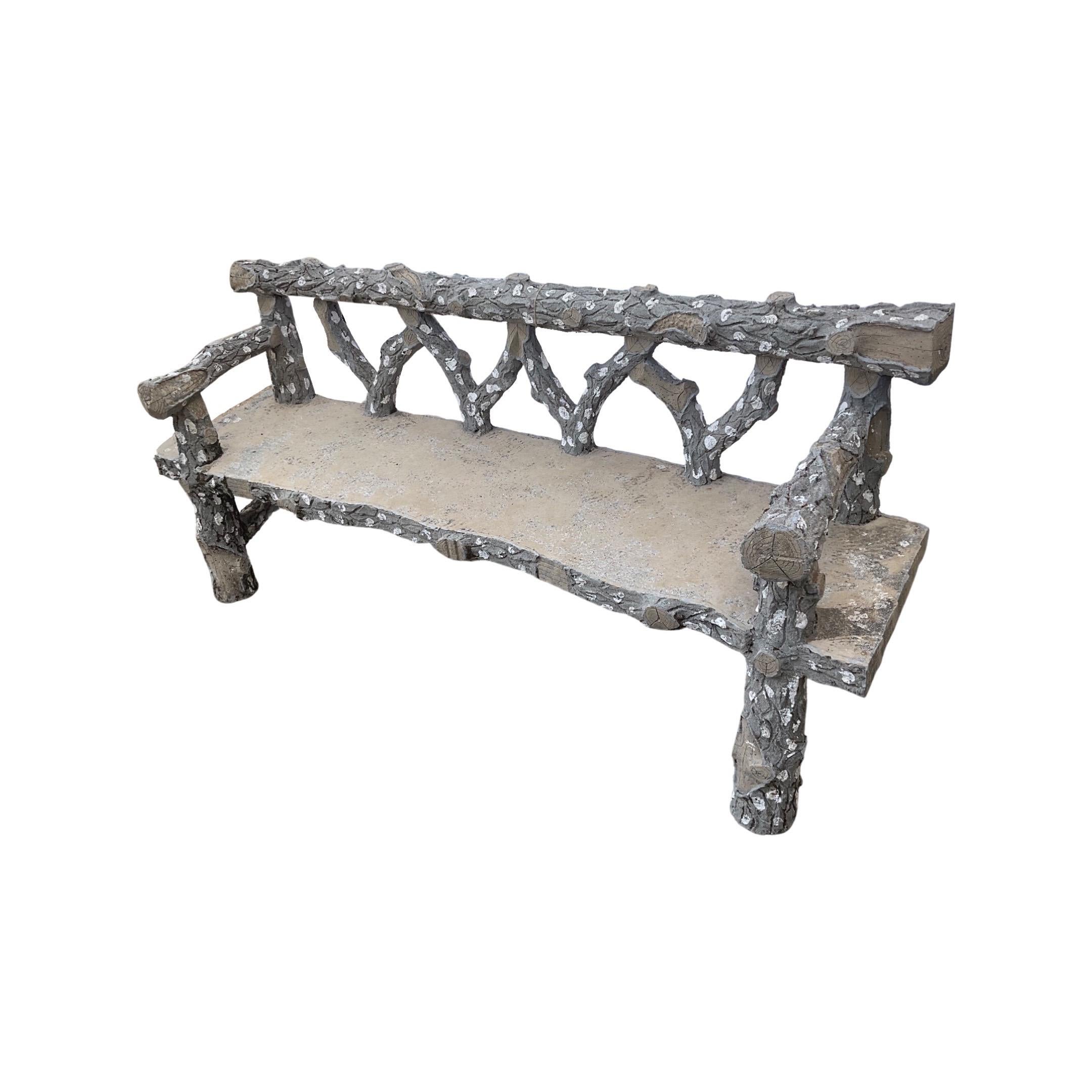 The French Faux Bois Bench from 1920 is crafted from Faux Bois, giving a one-of-a-kind natural look. This unique bench is a rare find, perfect for adding a touch of sophistication to any space.