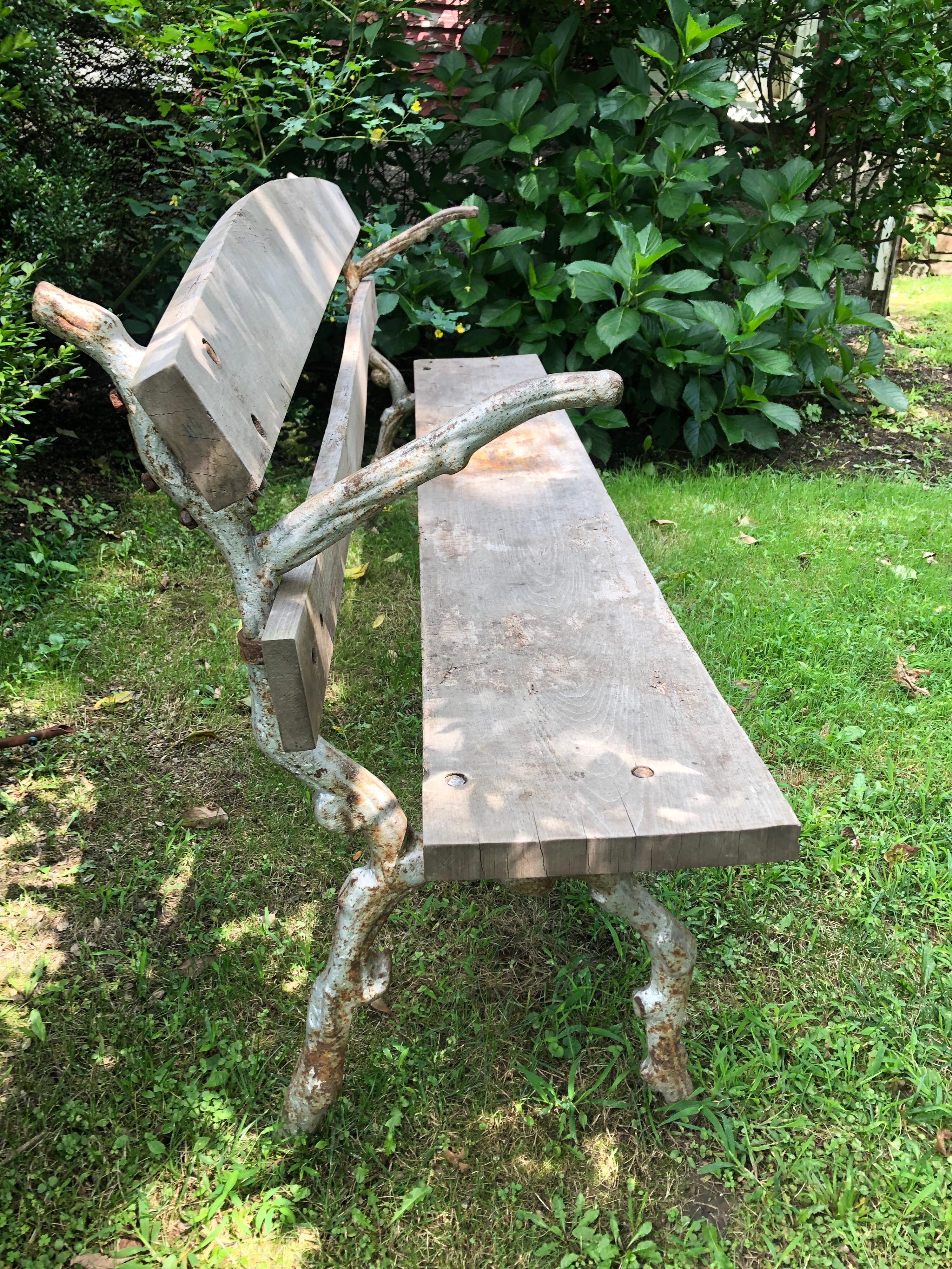 A large French faux bois cast iron and wood park bench.