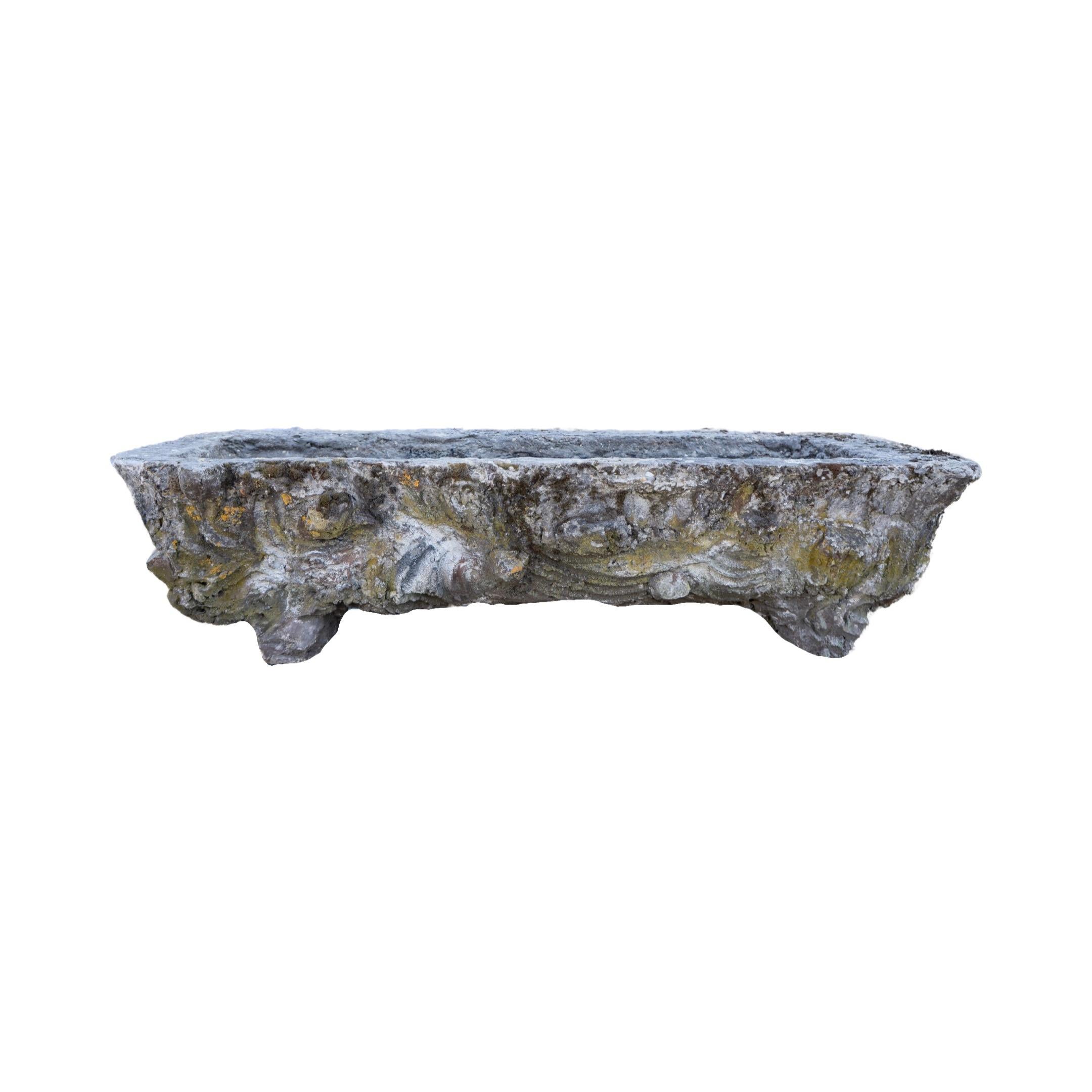 This French Faux Bois Limestone Trough, originating from 1900s France, boasts a stunning faux wood design crafted from durable limestone. Perfect for adding a touch of historic elegance to any outdoor space.