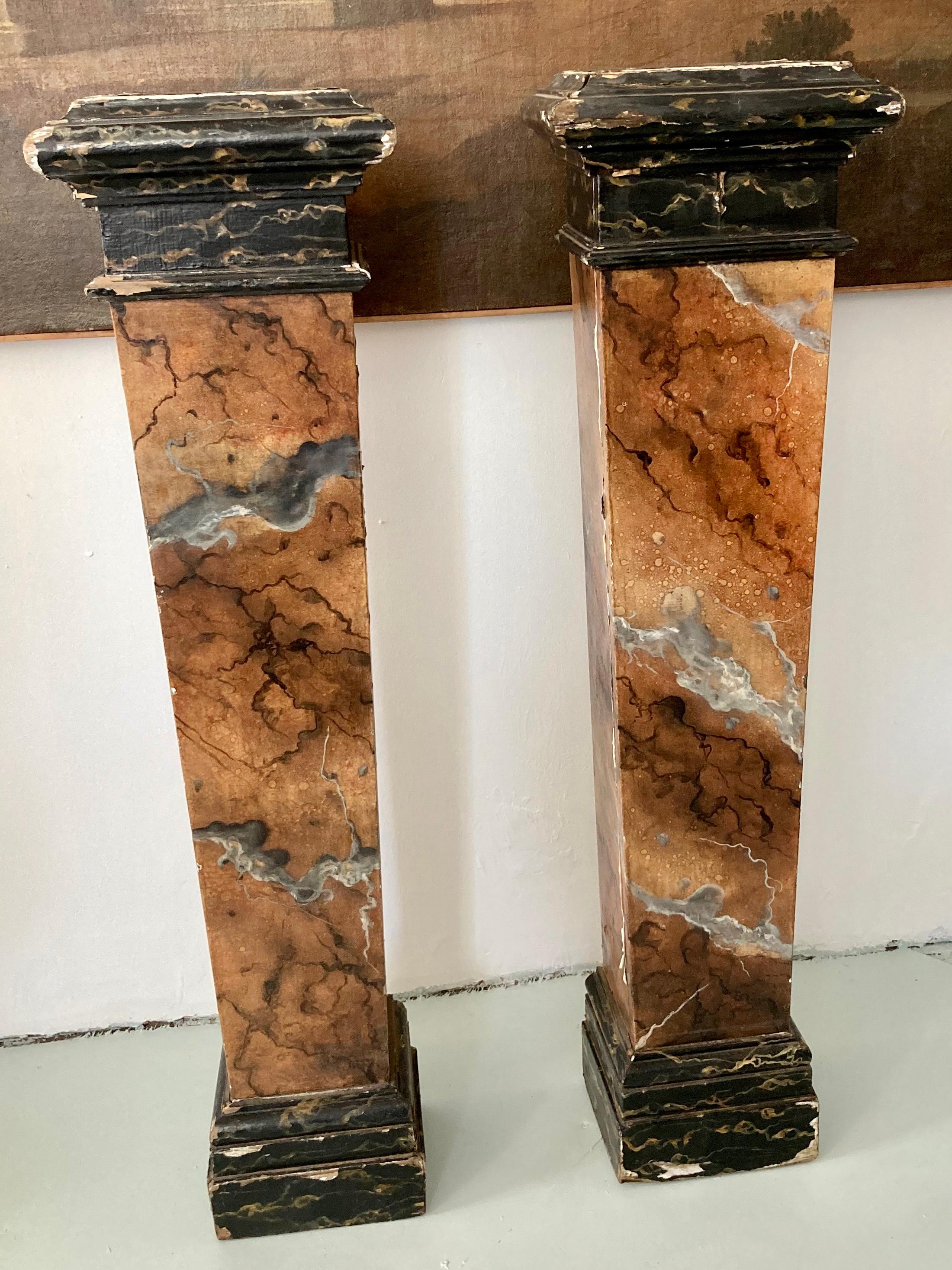 Pair of French faux marble wood pedestals. Great addition to your French architectural inspired interiors. From the estate of Tony Duquette.
