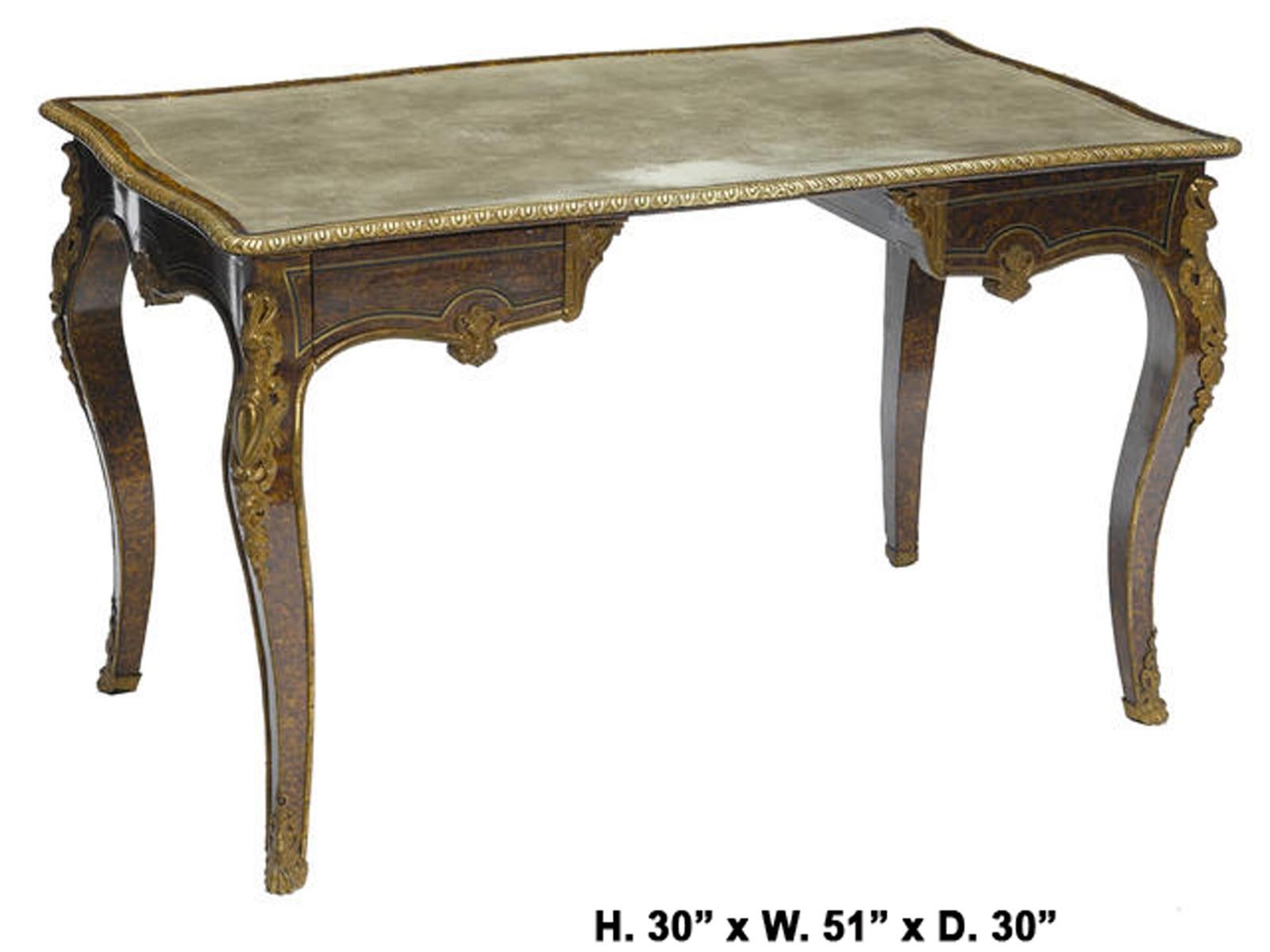A unique French Louis XV style faux tortoise shell painted gilt bronze mounted bureau plat desk.
19th century. 

The shaped top is inset with a tooled writing surface and bordered with an egg and dart bronze trimming, above a uniquely shallow