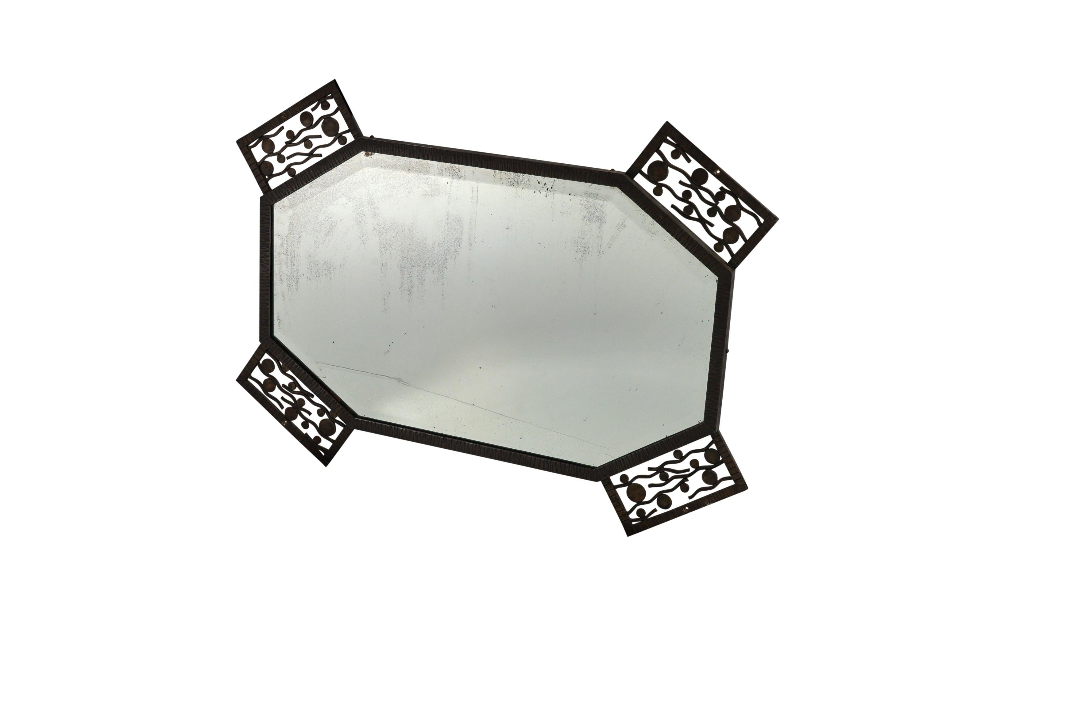French fer forge wrought iron mirror with eight sides and four corners with a seaweed pattern and original beveled mirror, circa 1930.